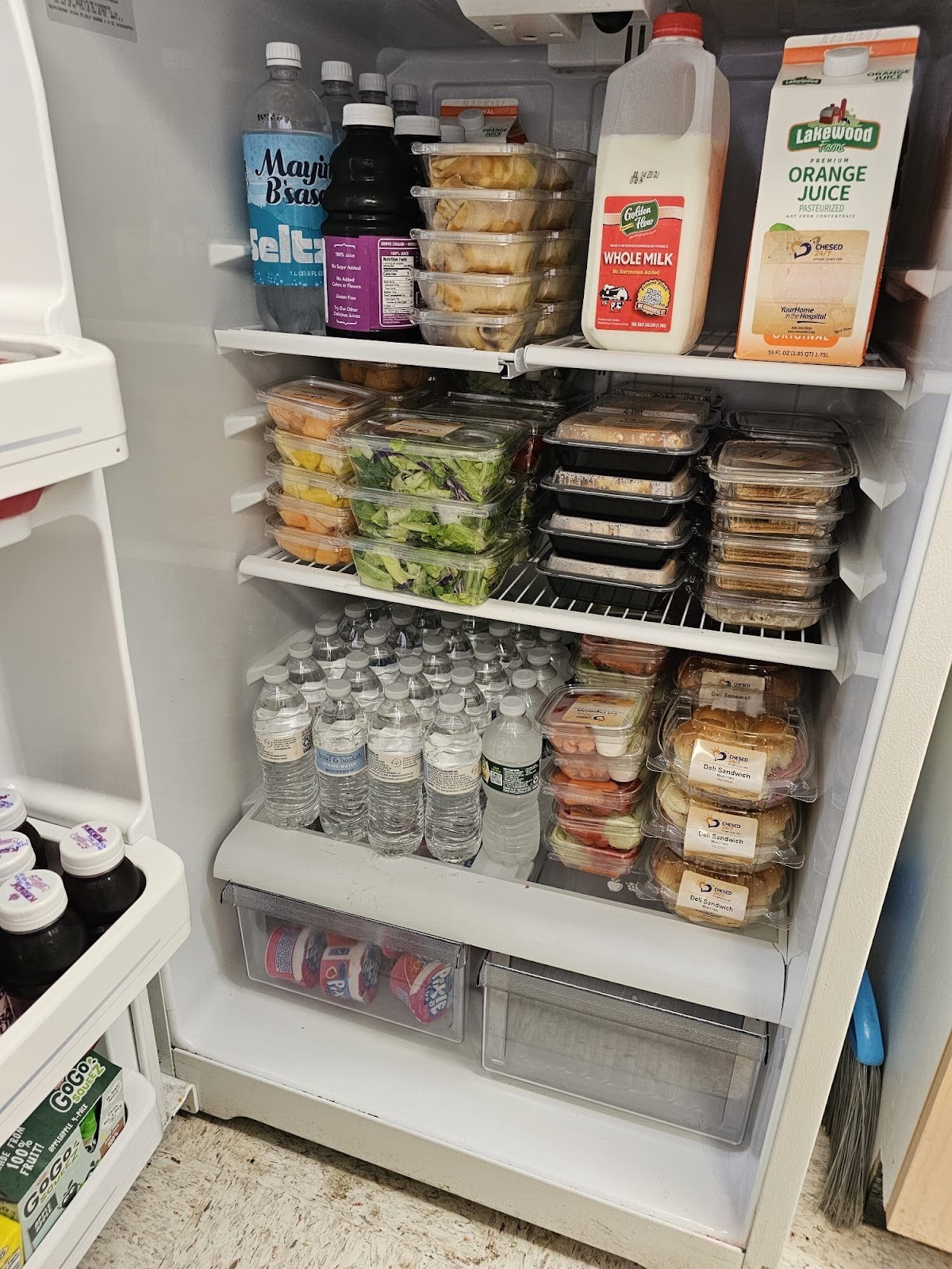 Fridge in Ellenville NY fully stocked with snacks drinks and meals on the go