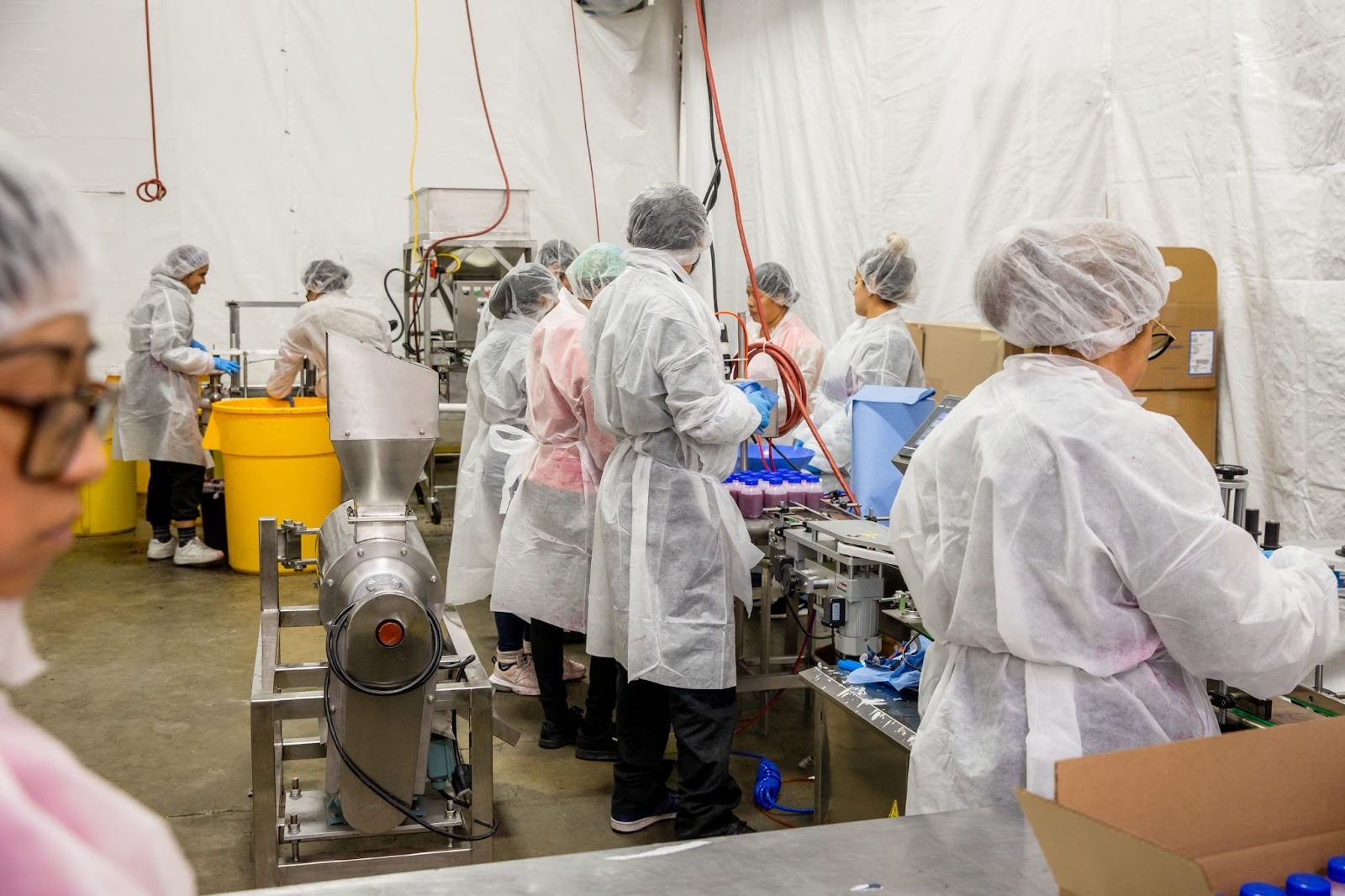 workers in David’s Cookie factory work efficiently to produce huge volumes of pomegranate juice