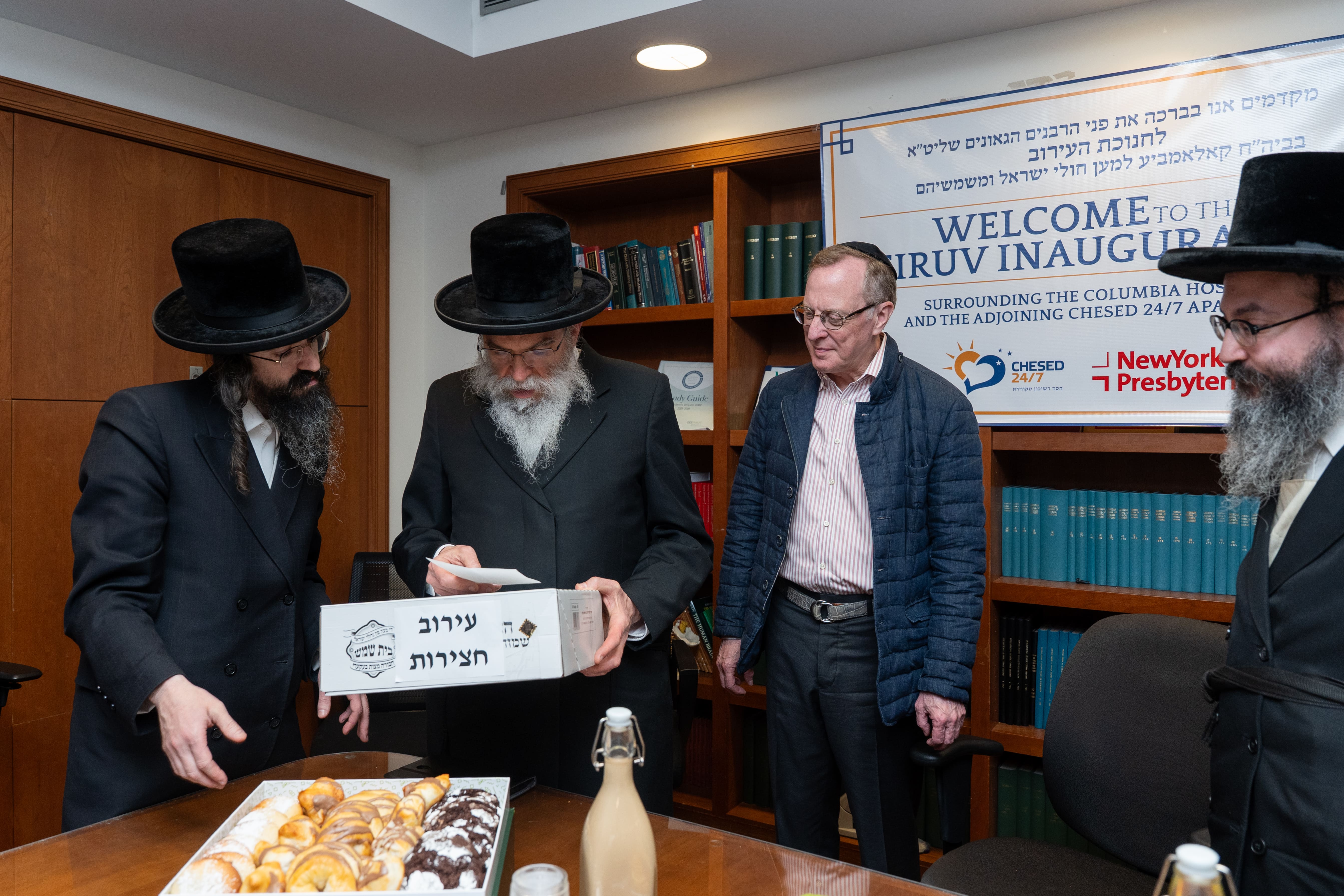 Rabbanim reviewing materials at Columbia Hospital Eiruv inauguration hosted by Chesed 24/7