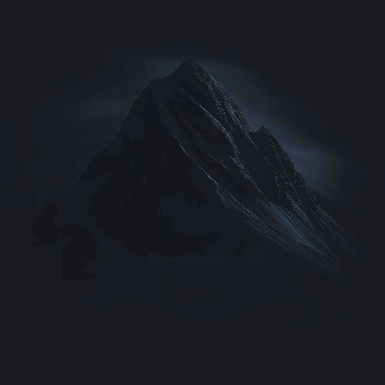 Dark, shadowed mountain peak with subtle highlights against a black background.