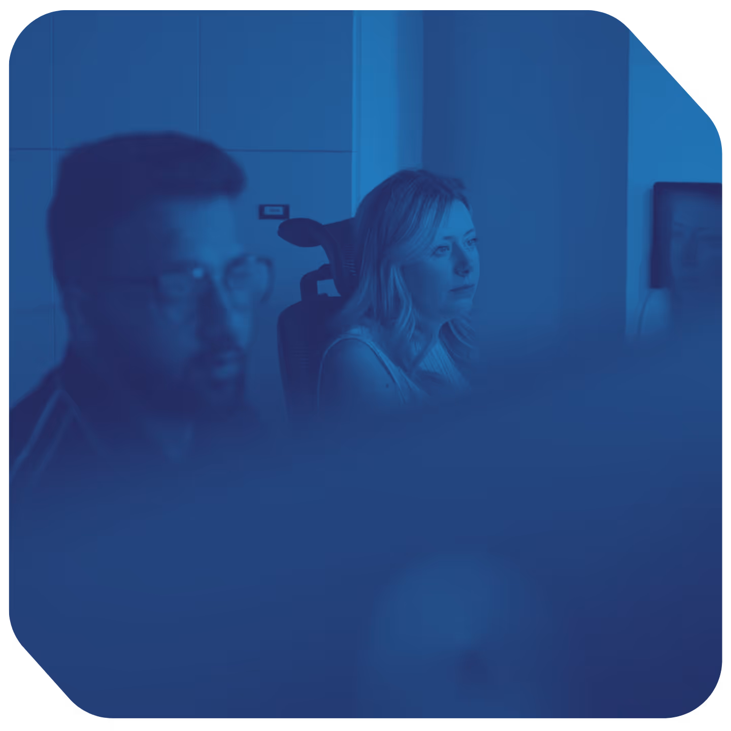 a man and woman sitting in a chair