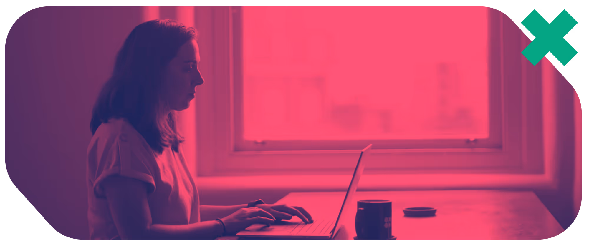 a woman sitting at a desk using a laptop
