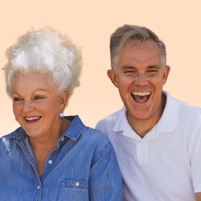 Elderly woman and middle-aged man laughing together. Clean Slate Clinic Clients.