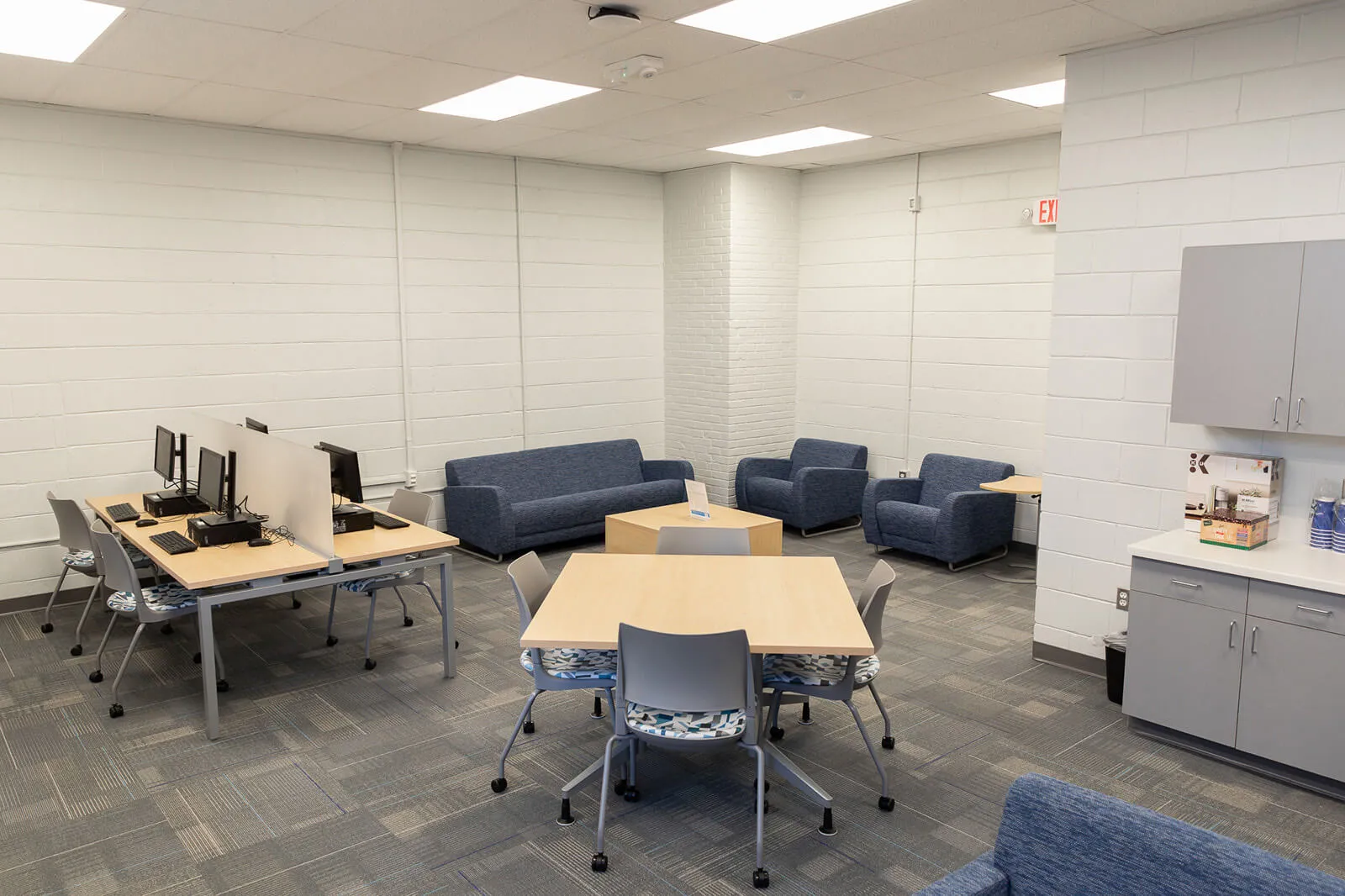 Luxury Vinyl Tile And Commercial-Grade Carpet In Renovated Space.