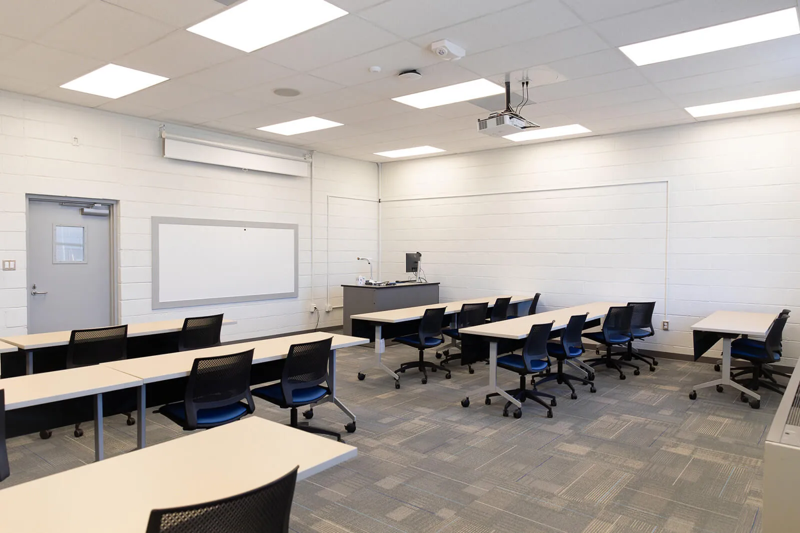 Renovated Educational Space With Modern Lighting And New Ceilings