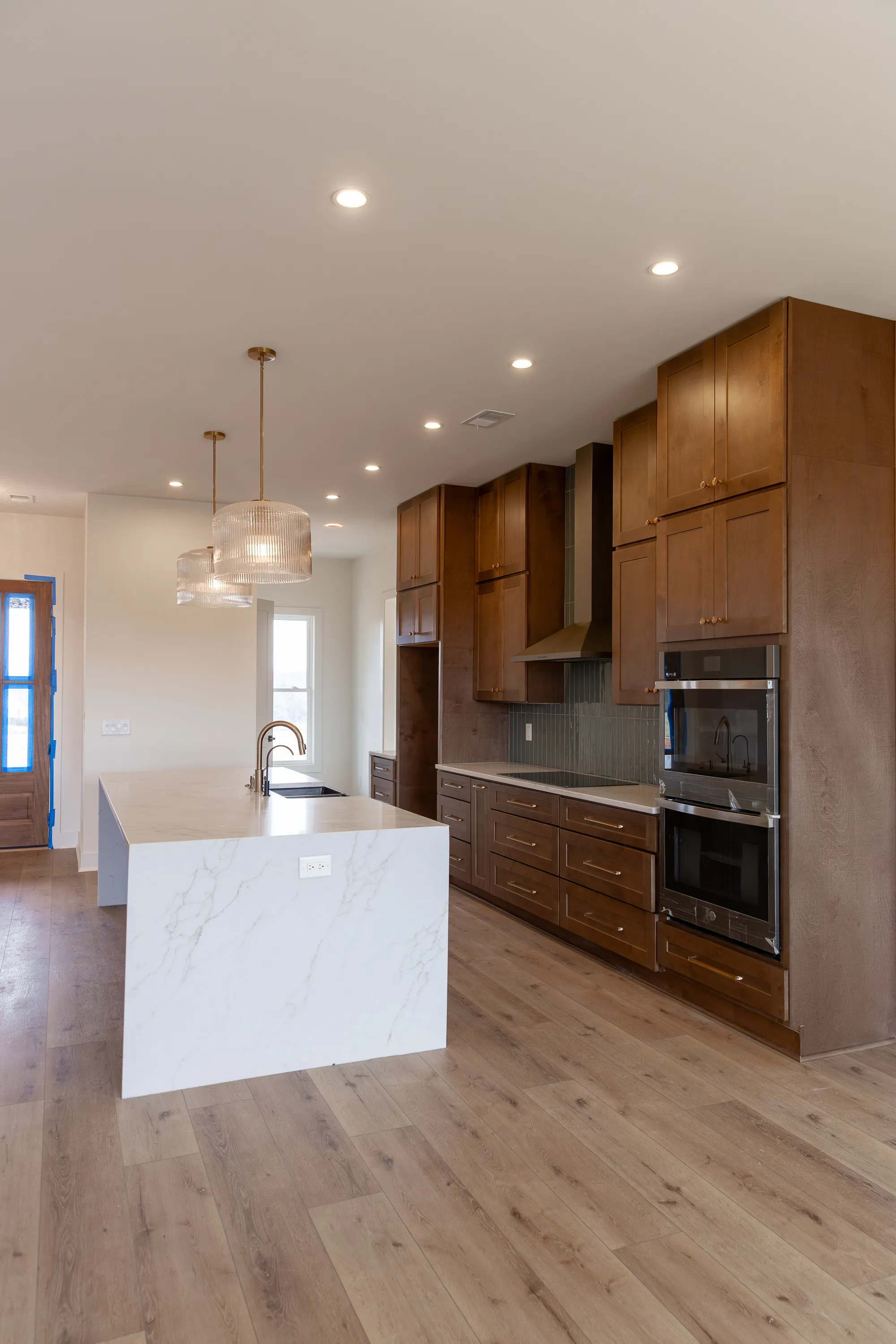 Modern Kitchen With Waterfall Island And Custom Design.