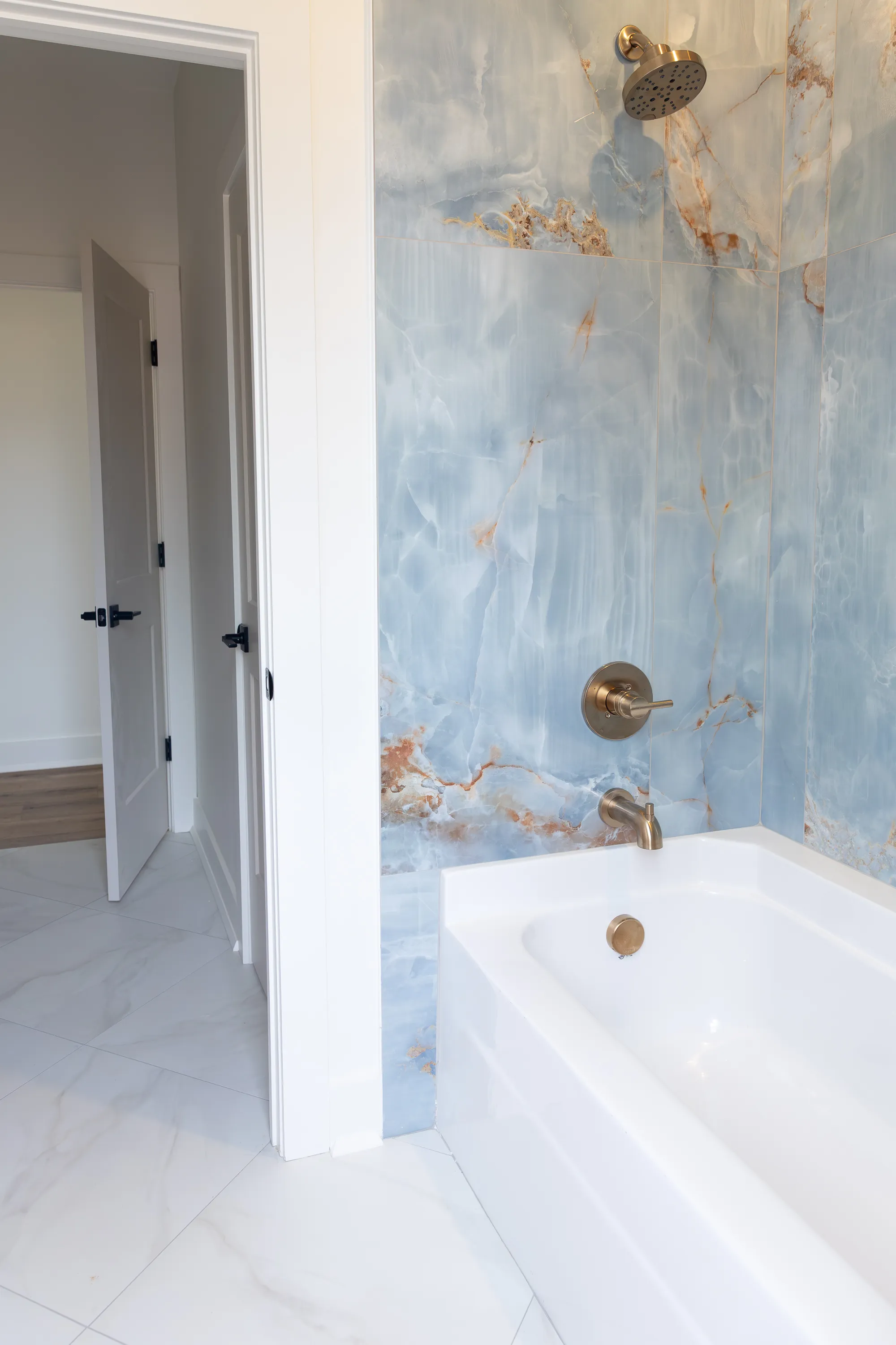 Stylish bathtub with contemporary tile surround.