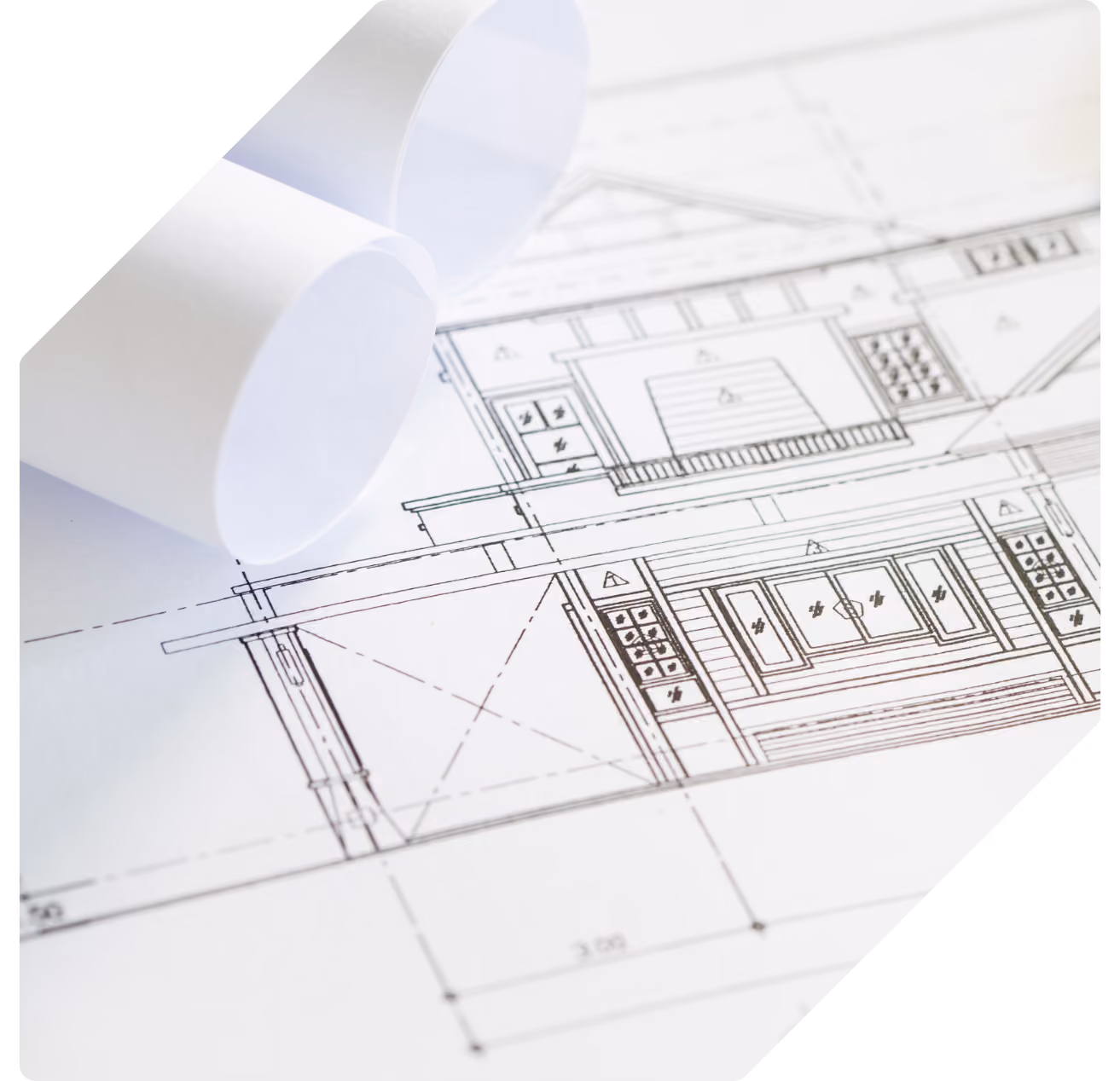 Rolled and flat architectural drawings showing a building elevation in fine line detail.