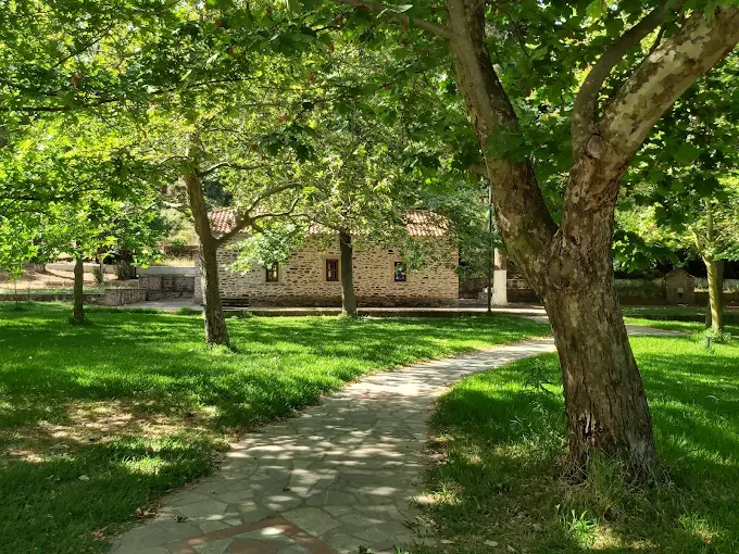 A garden view of a church.
