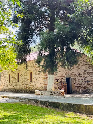 A garden view of a church.