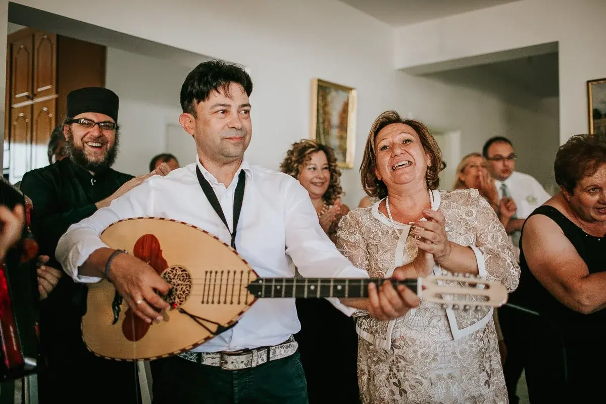 Musicians playing music in a house.