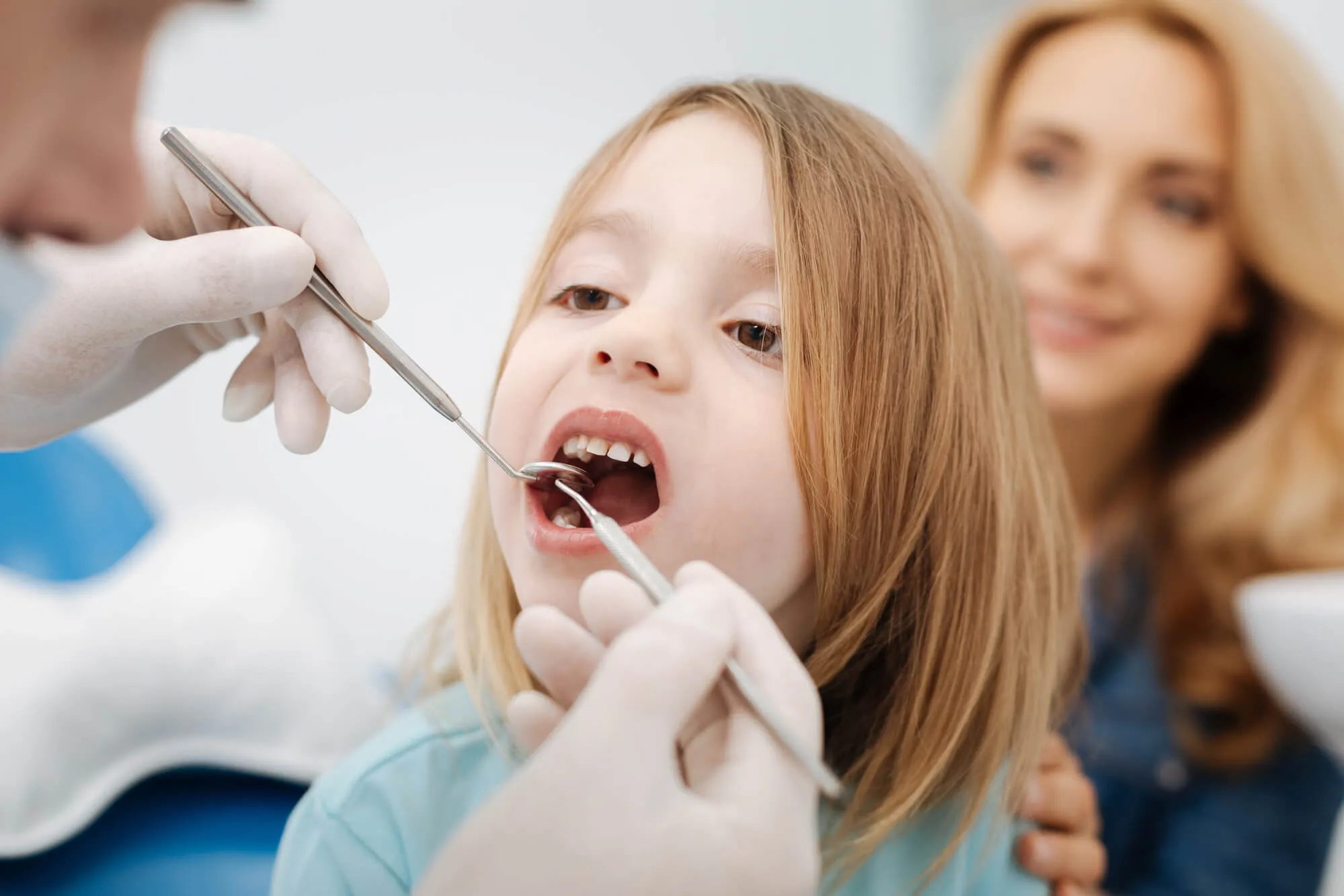 dentist checking on kid's teeth as part of Family dentistry in plantation fl.jpg