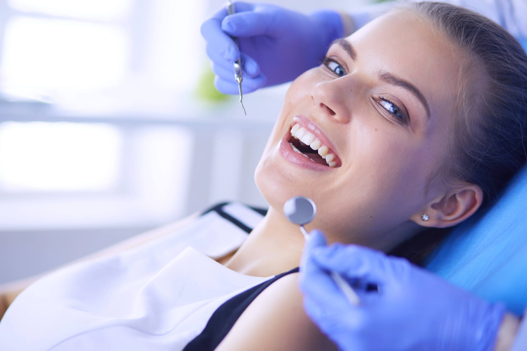 patient smiling at a dental office in plantation fl