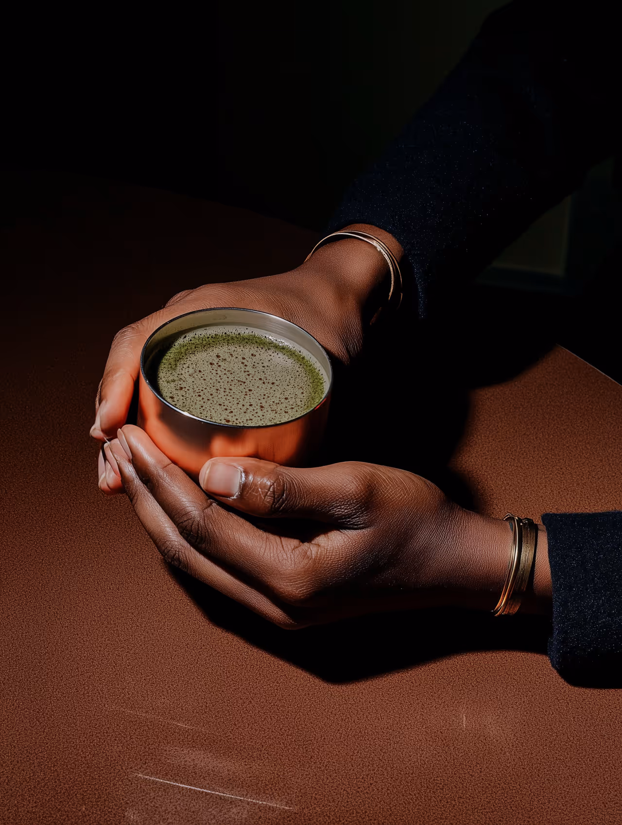 Hands holding a fancy Matcha Cupl