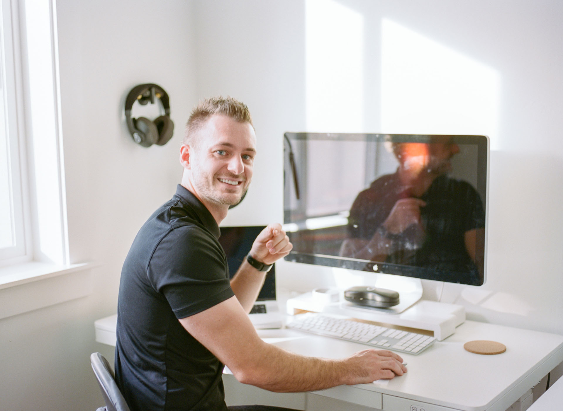 Kaleb Dean of Studio Ostendo working on design at his desk.
