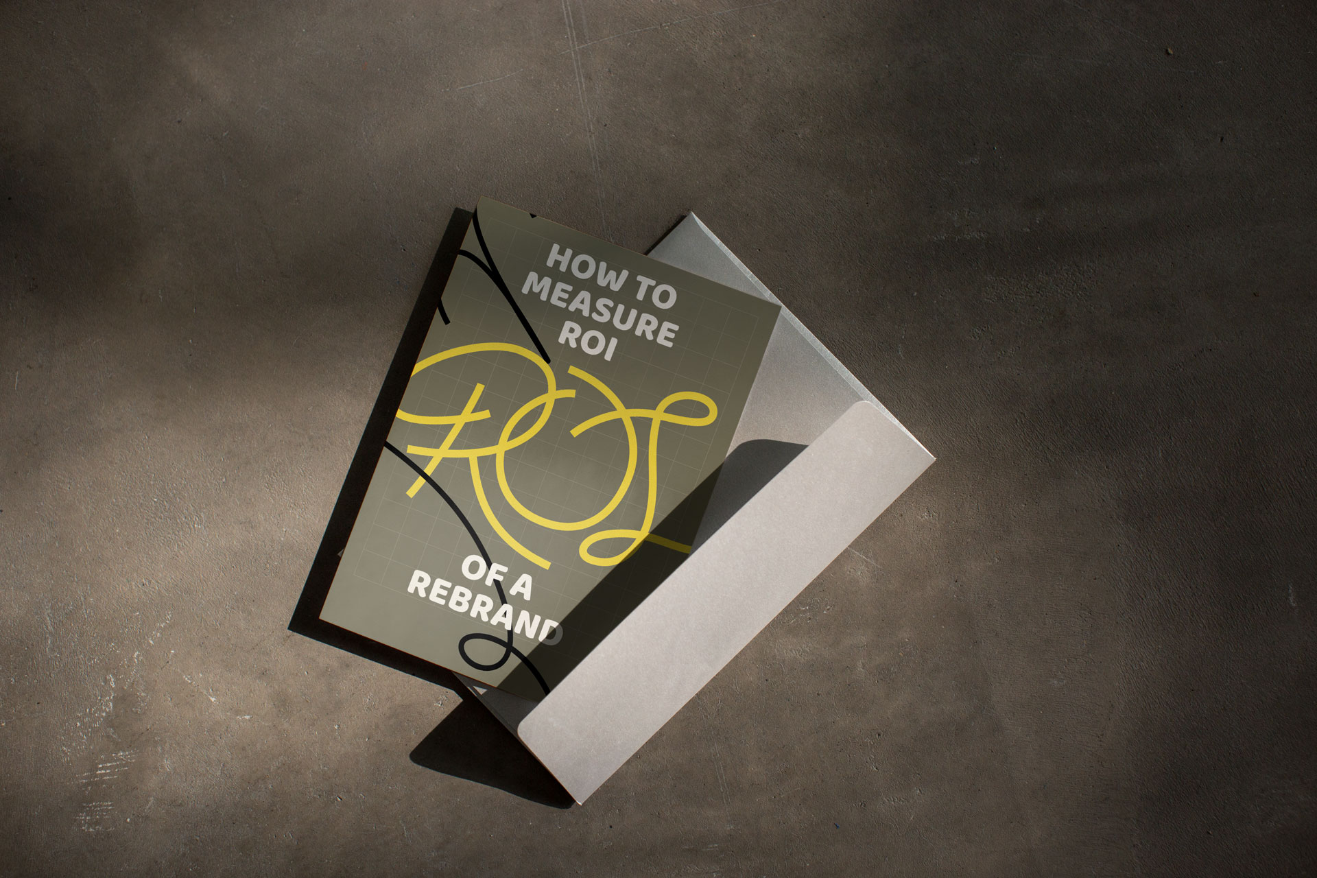 An envelope and card that says "How to measure ROI of a rebrand"
