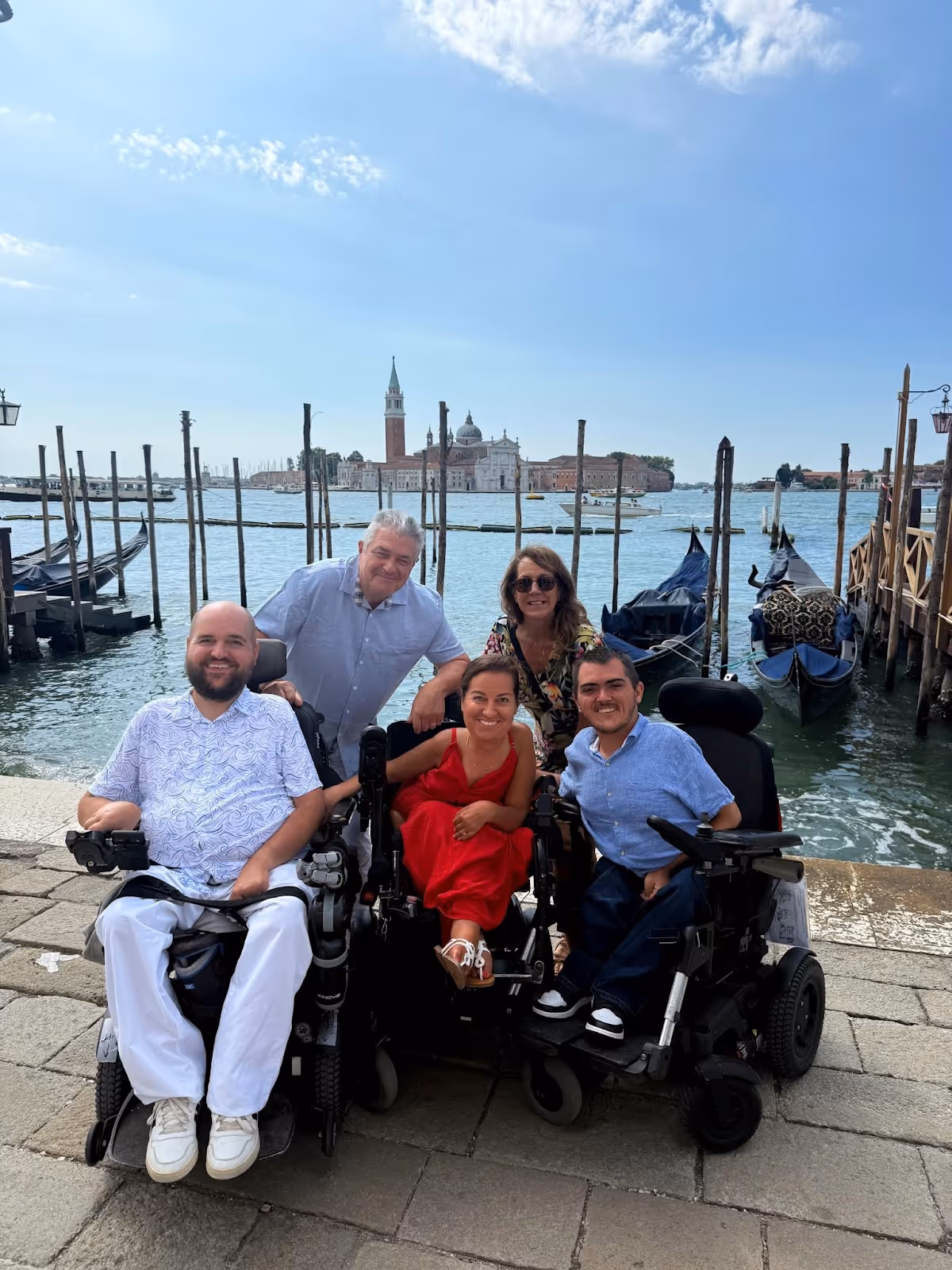 Family with three wheelchairs in front of Venice Canal