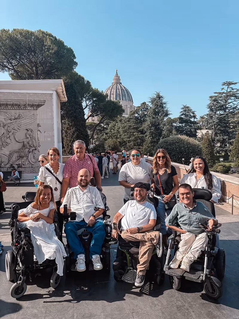 A group photo with the St. Peter's Basilica in the background