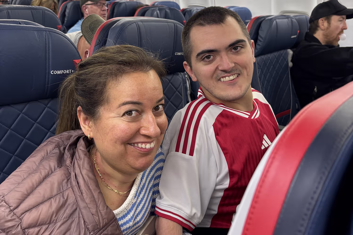 Couple seated together on a Delta flight to Cancun