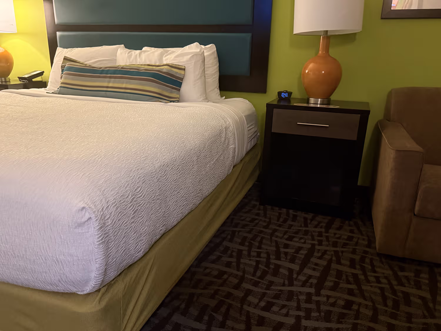 King bed in an accessible room at Shephard’s Beach Resort with no clearance underneath
