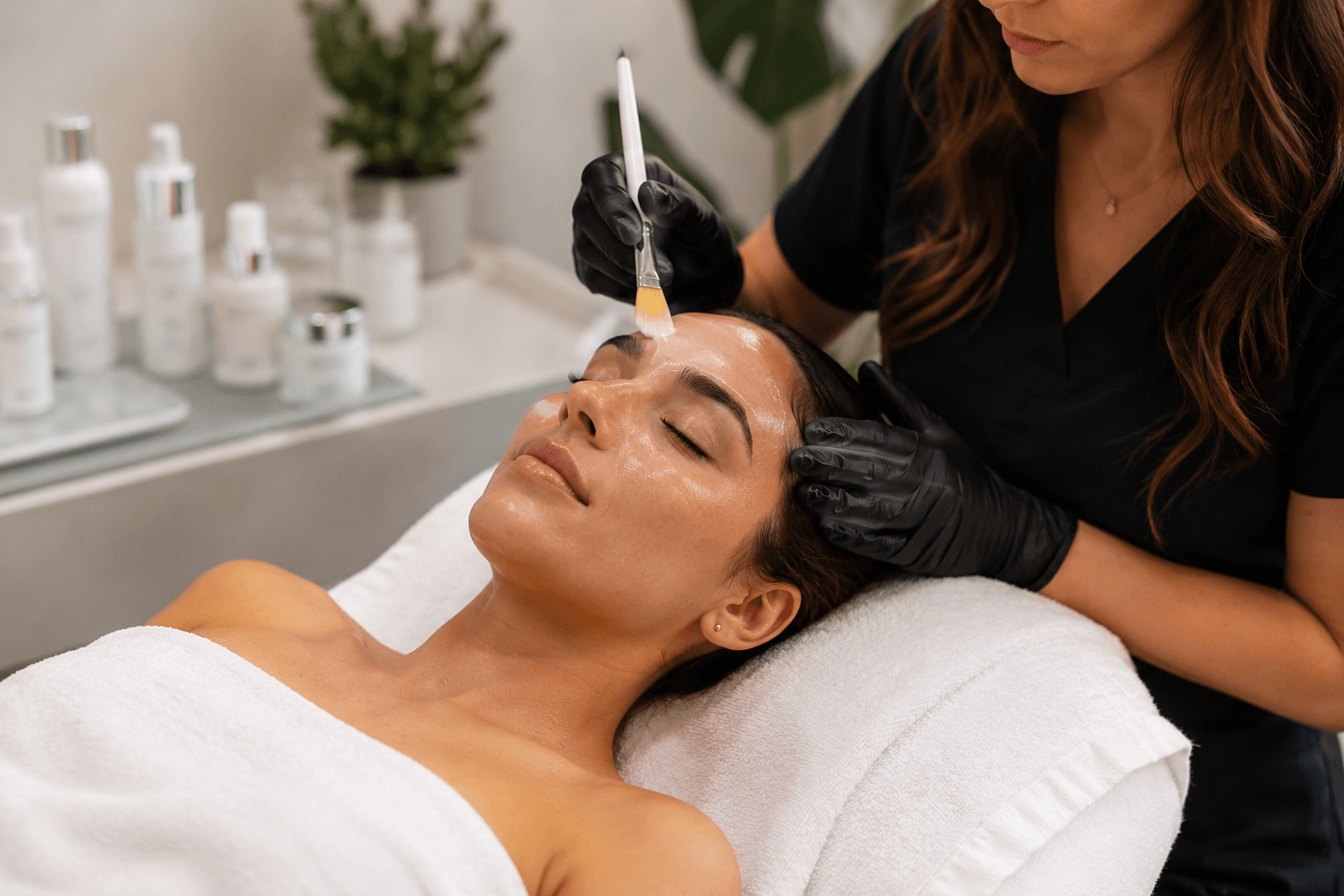 Woman receiving a customized facial treatment from an aesthetician in Scottsdale, Arizona to improve hydration, skin texture, and overall skin health.