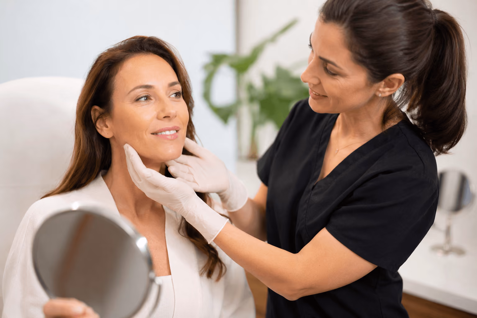 Provider consulting with a patient about Sculptra treatment for natural facial volume restoration in Scottsdale, Arizona.