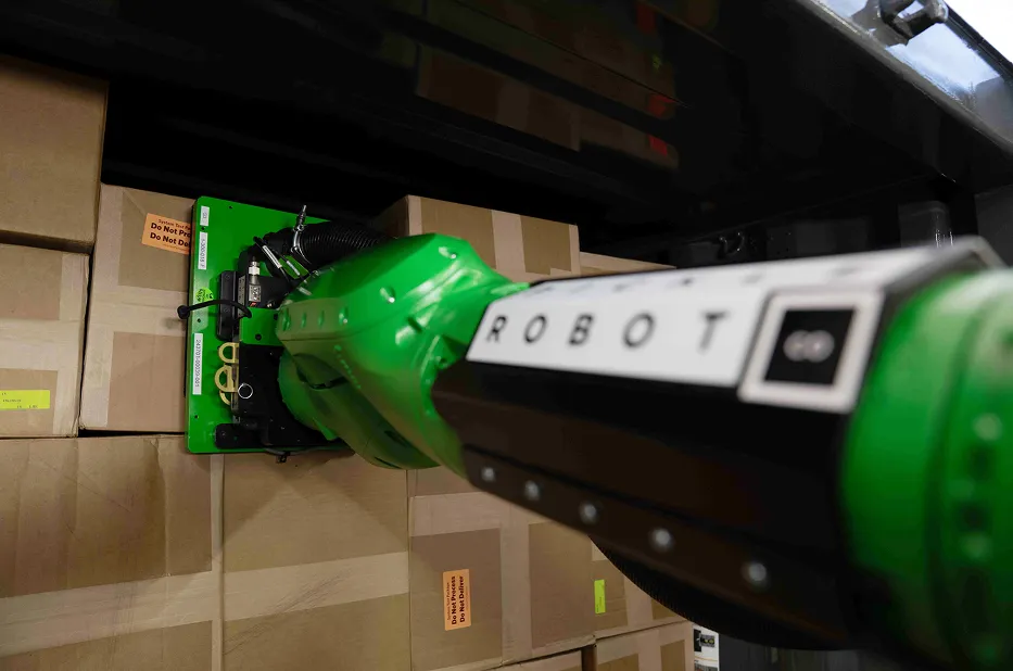 Pickle robot arm reaching for a box