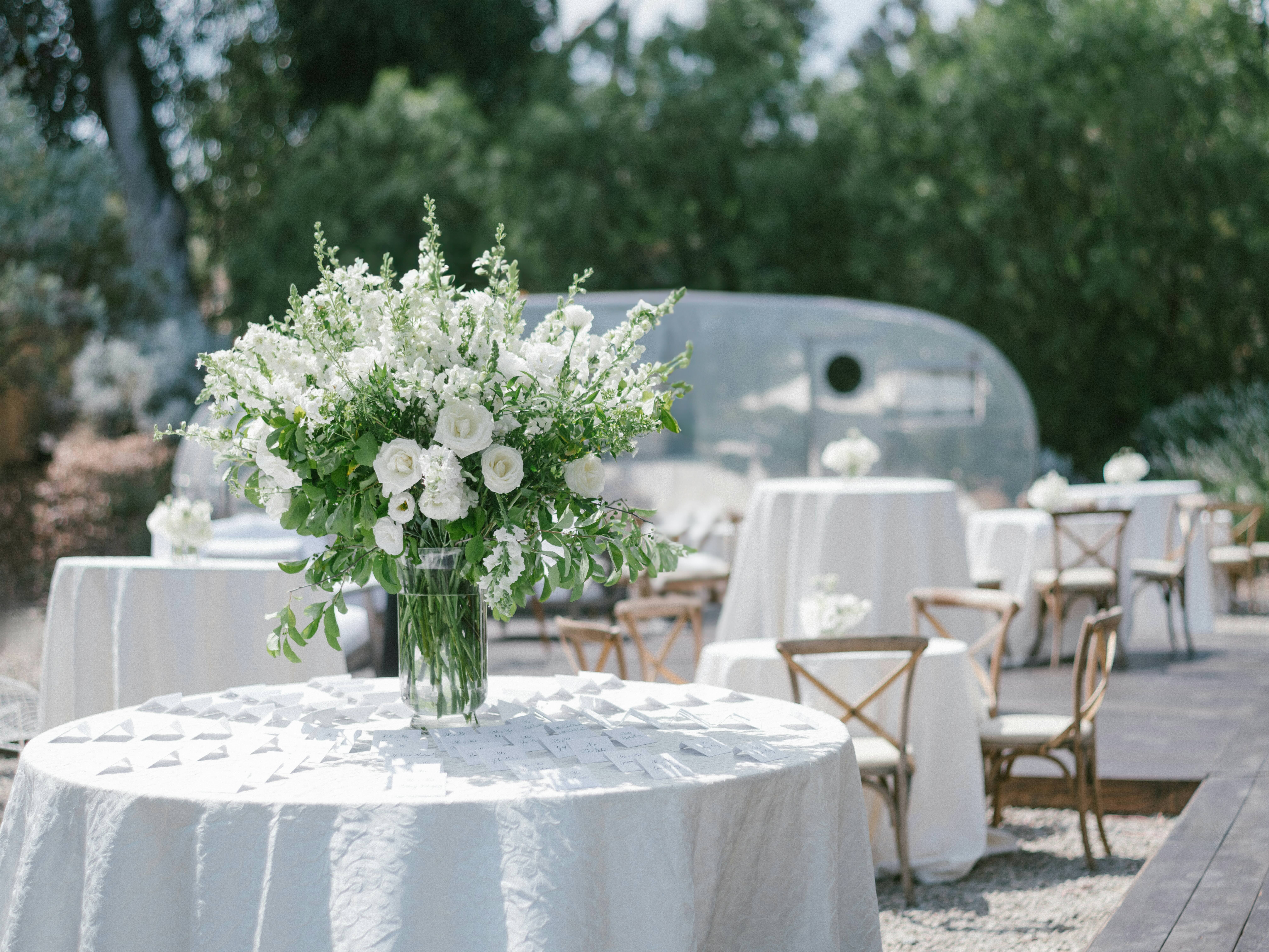 Table details with florals at summer wedding. 
