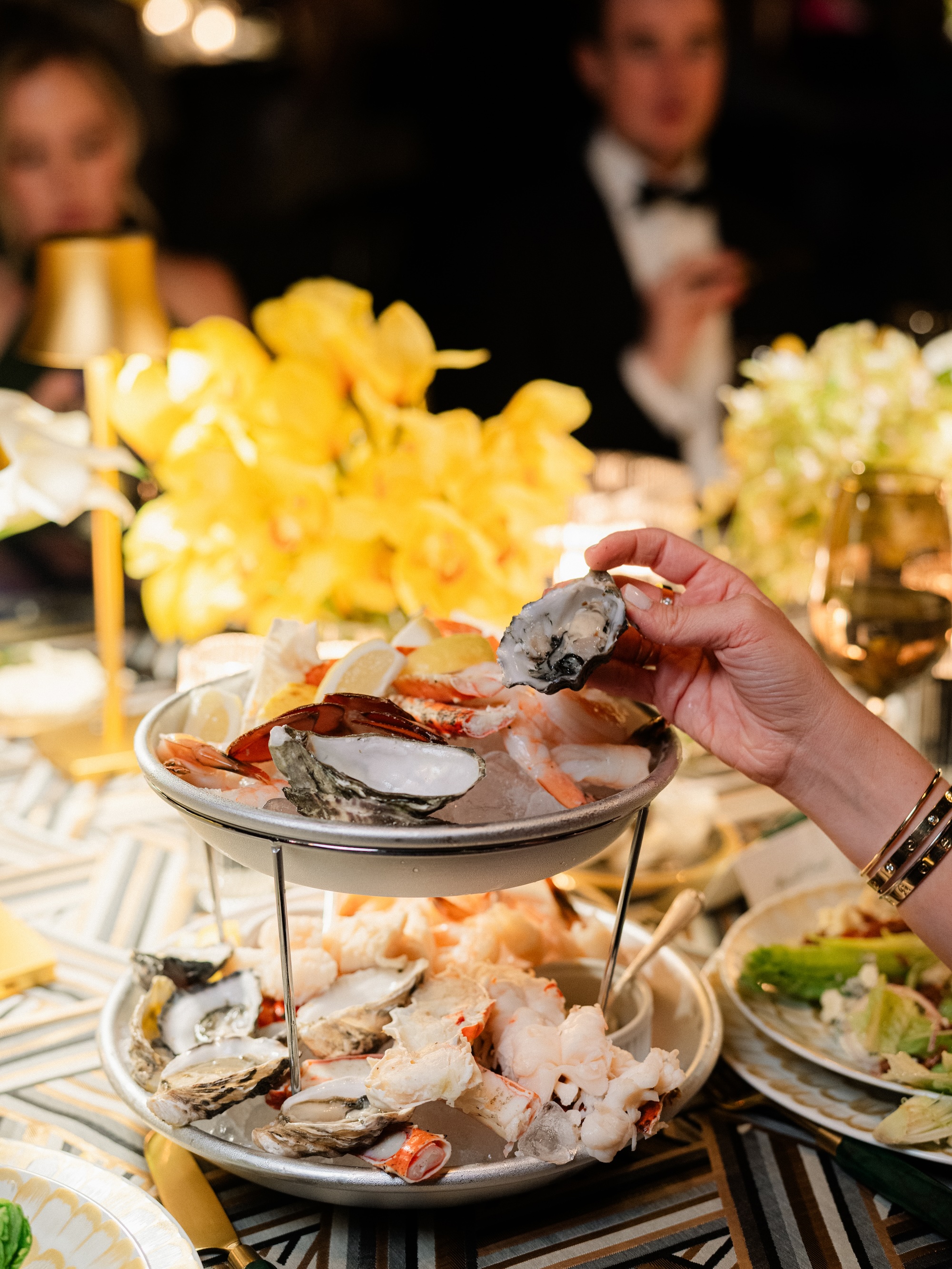 Desert Weekend, guest serving oysters at table