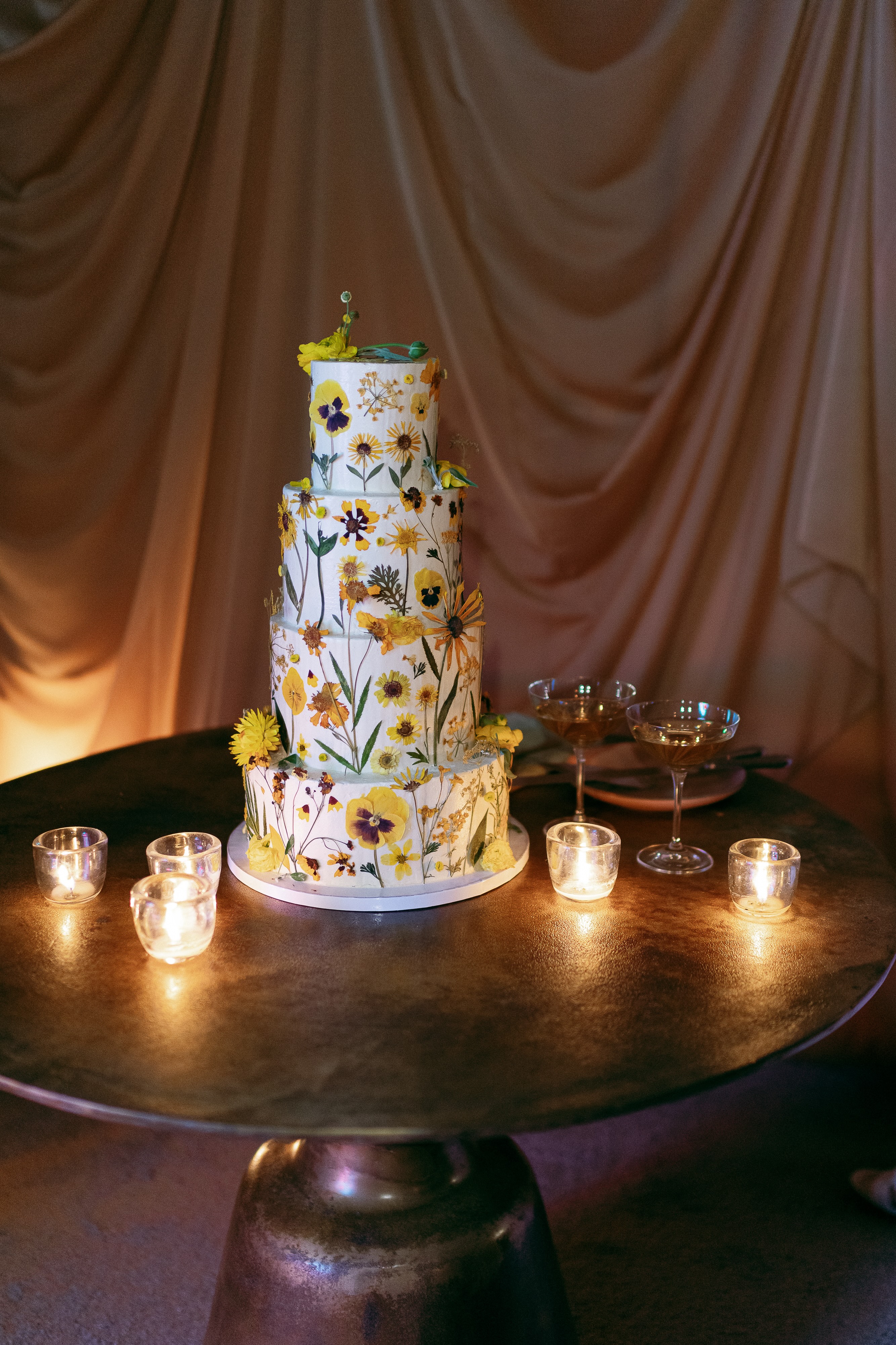 Boho chic wedding, wedding cake with martinis ready for bride and groom