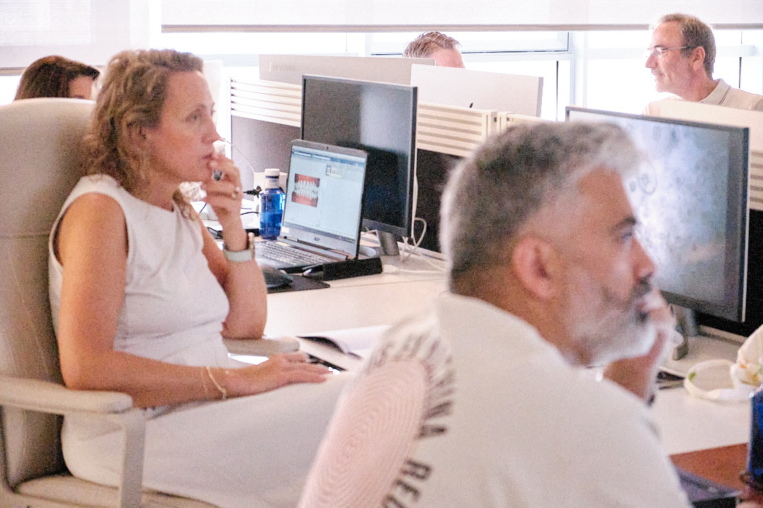 2 students listen with attention to explaination