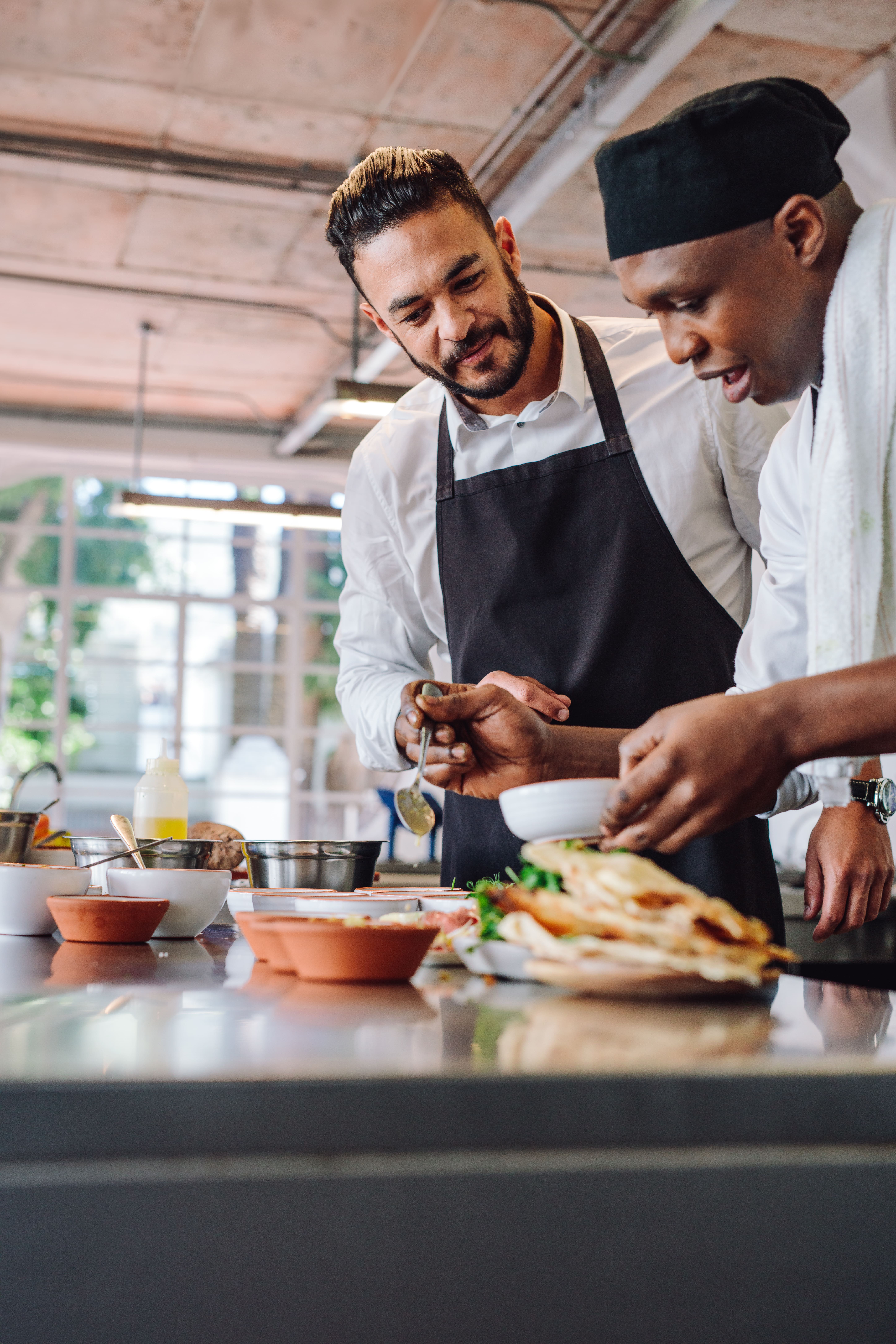Two men cooking a meal