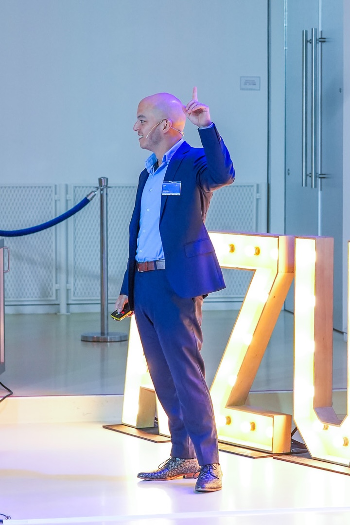 Picture of Lloyd Tan presenting and showing audience participation