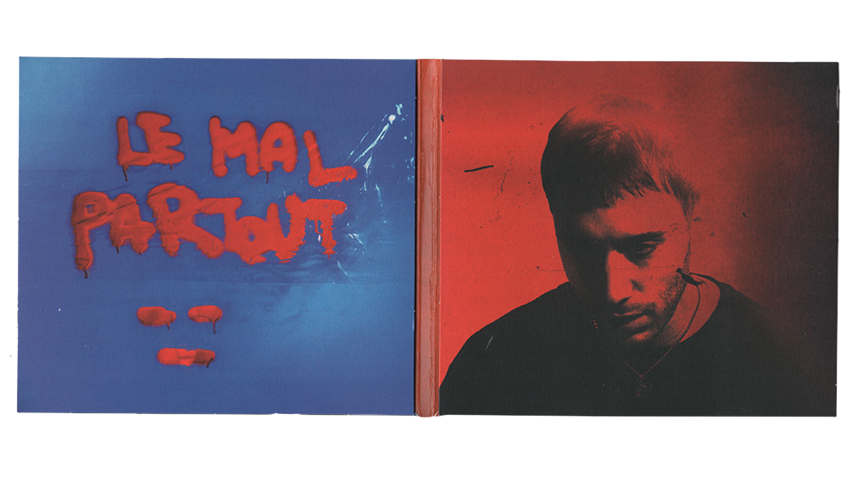 Album cover with red graffiti text 'LE MAL PARTOUT' on a blue background on the left and a red-toned photo of a man looking down on the right.