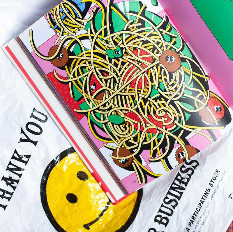 Open book with a colorful cartoon illustration of spaghetti, meatballs, and vegetables with eyes on a white plastic bag featuring a large yellow smiley face and the text 'THANK YOU'.