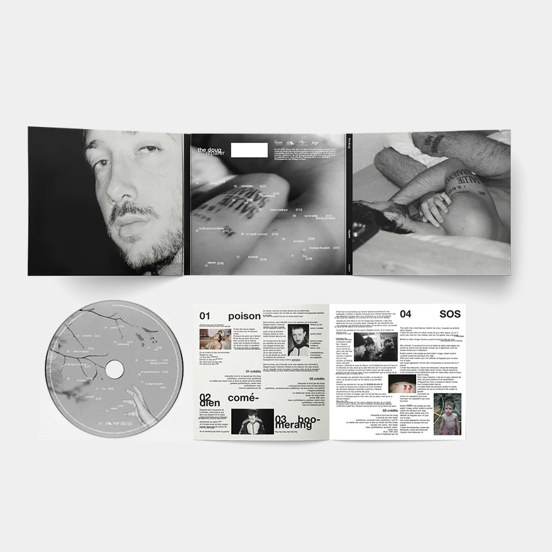 CD album packaging with black and white close-up photos of a tattooed man, and booklet pages including song titles and lyrics.
