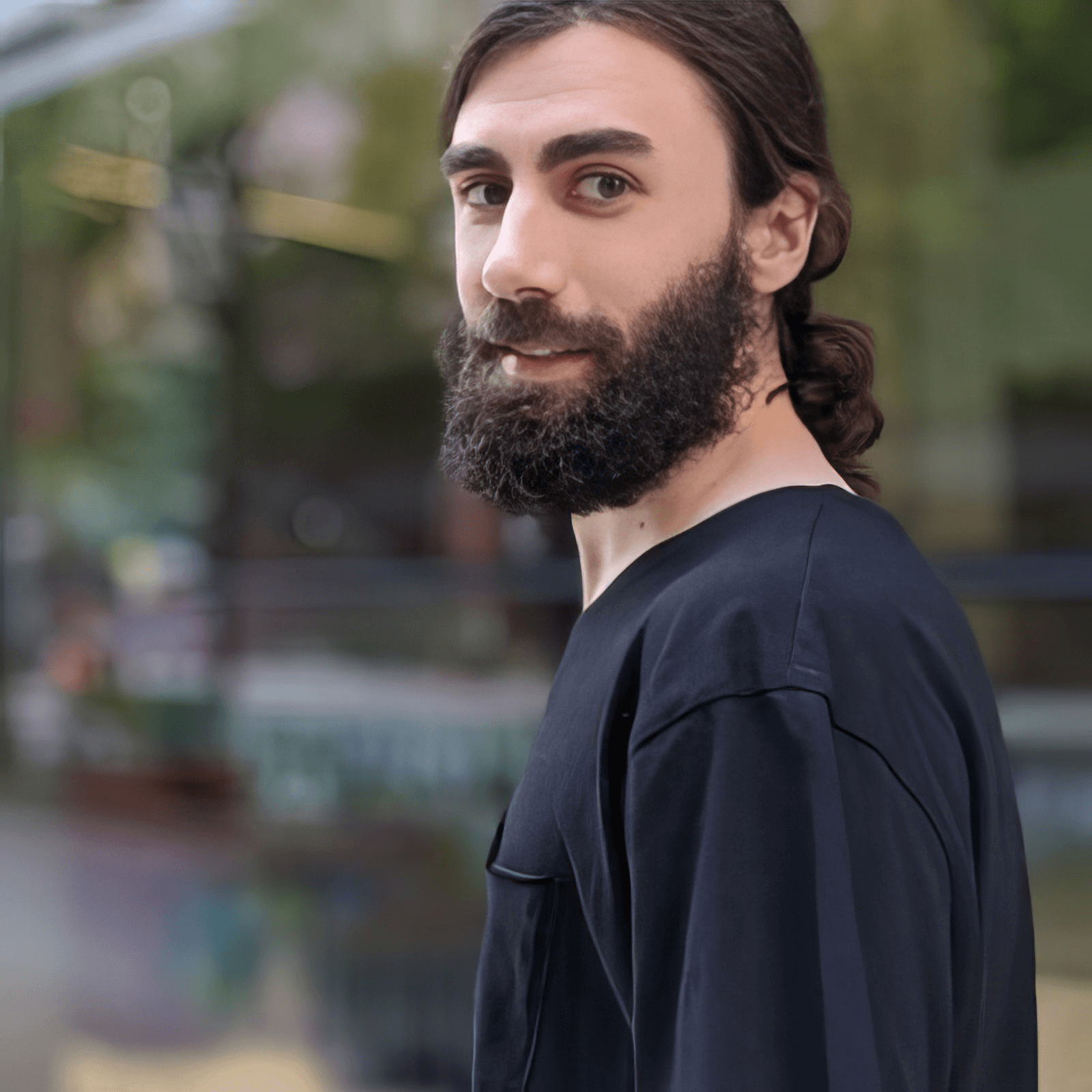 KBS co-owner standing outside a workspace, representing the Kind Business Services leadership team.