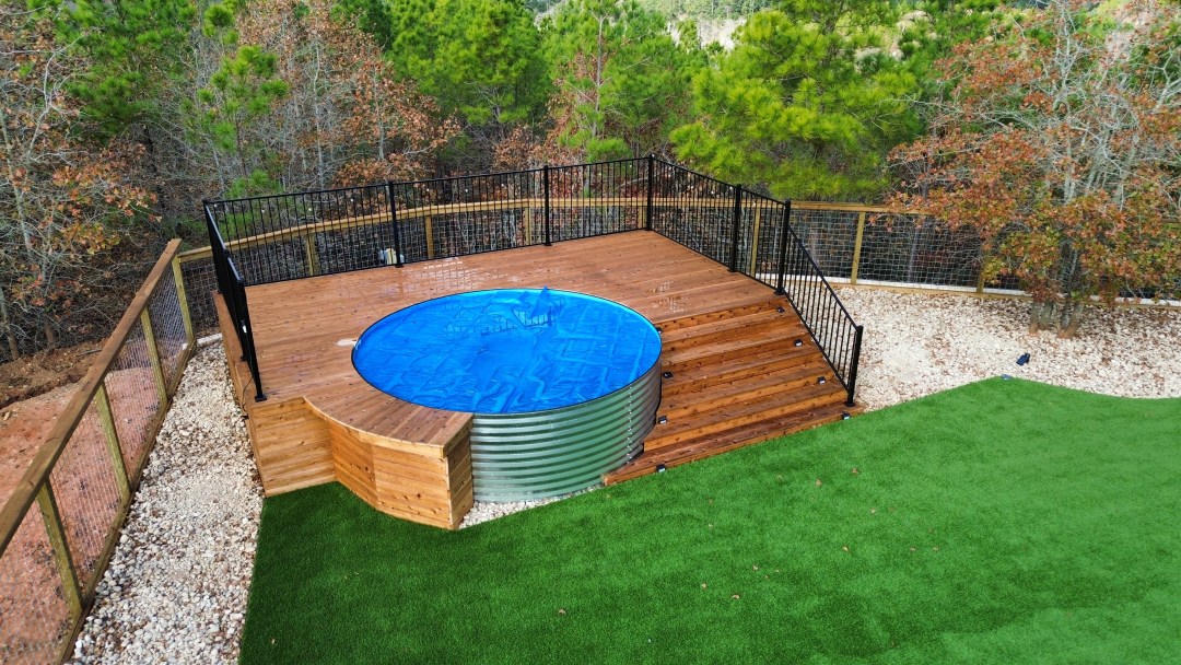 Cedar deck around above ground stock tank pool 