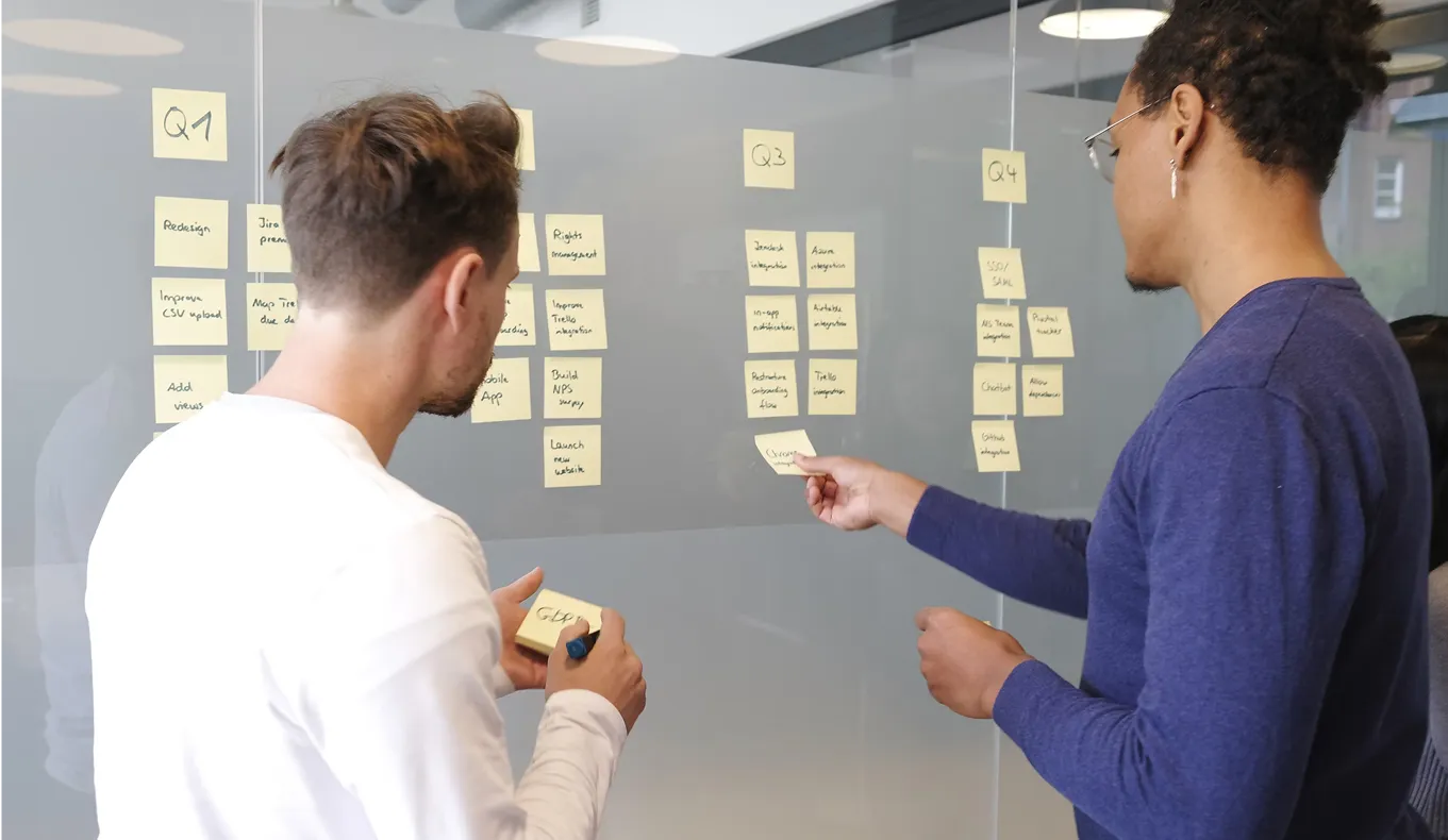 putting sticky notes on a glass window