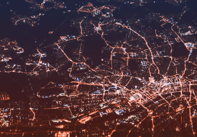 Aerial view of a small city at night.