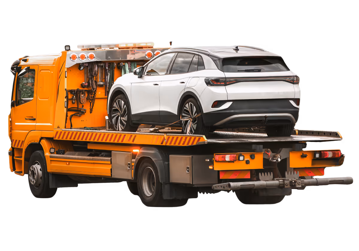 White SUV secured on an orange flatbed tow truck.