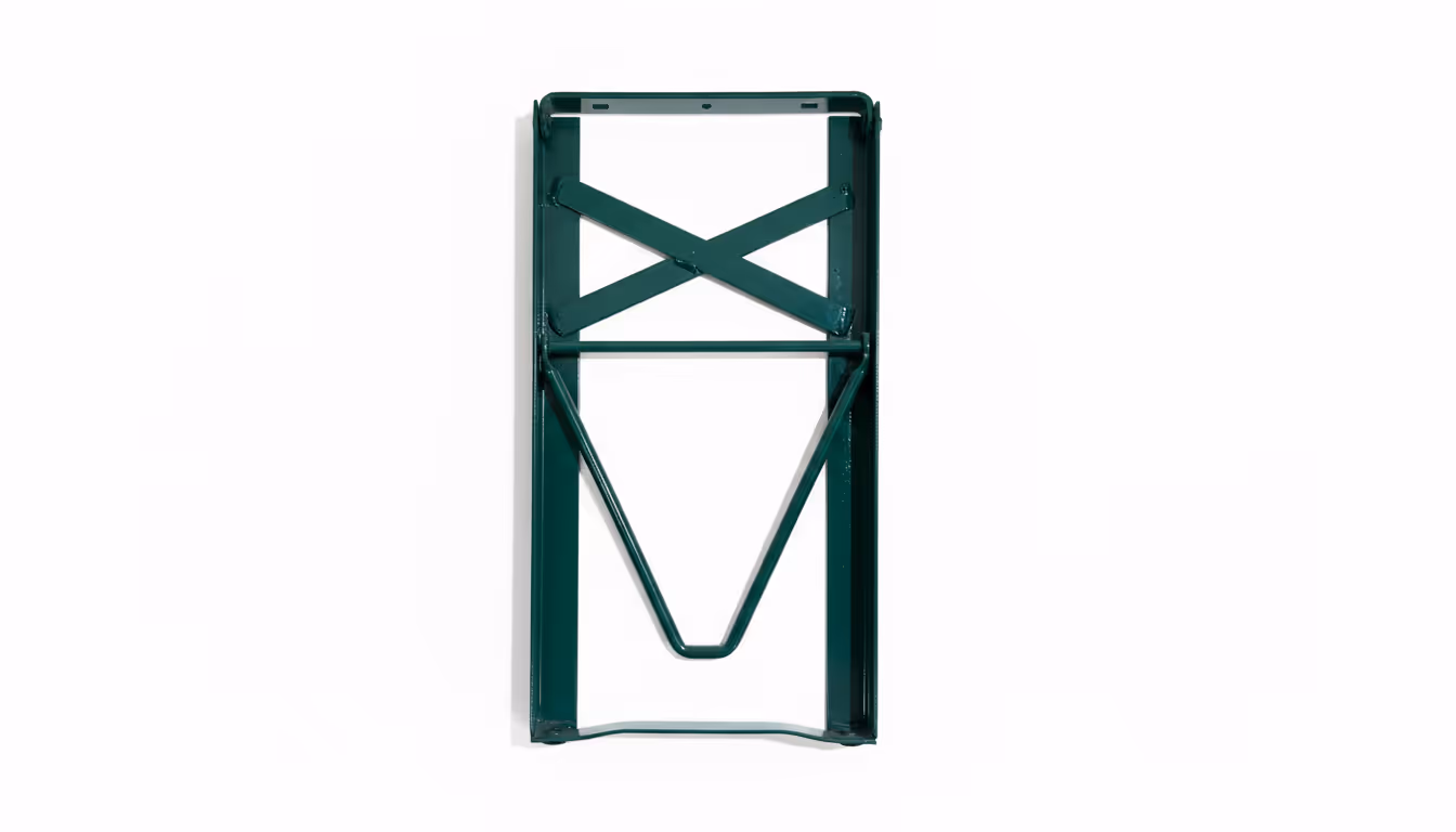 Green metal folding chair frame folded flat against a white background.