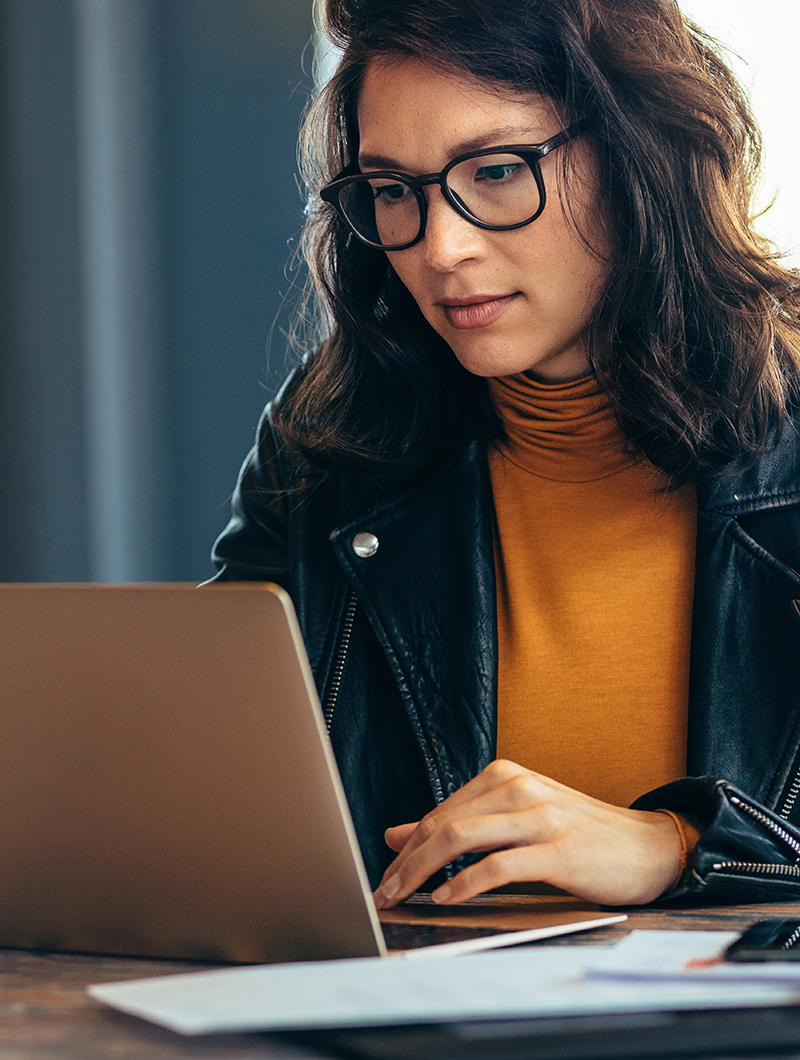 Female Healthcare Professional working with the SwissDTx Care Dashboard.