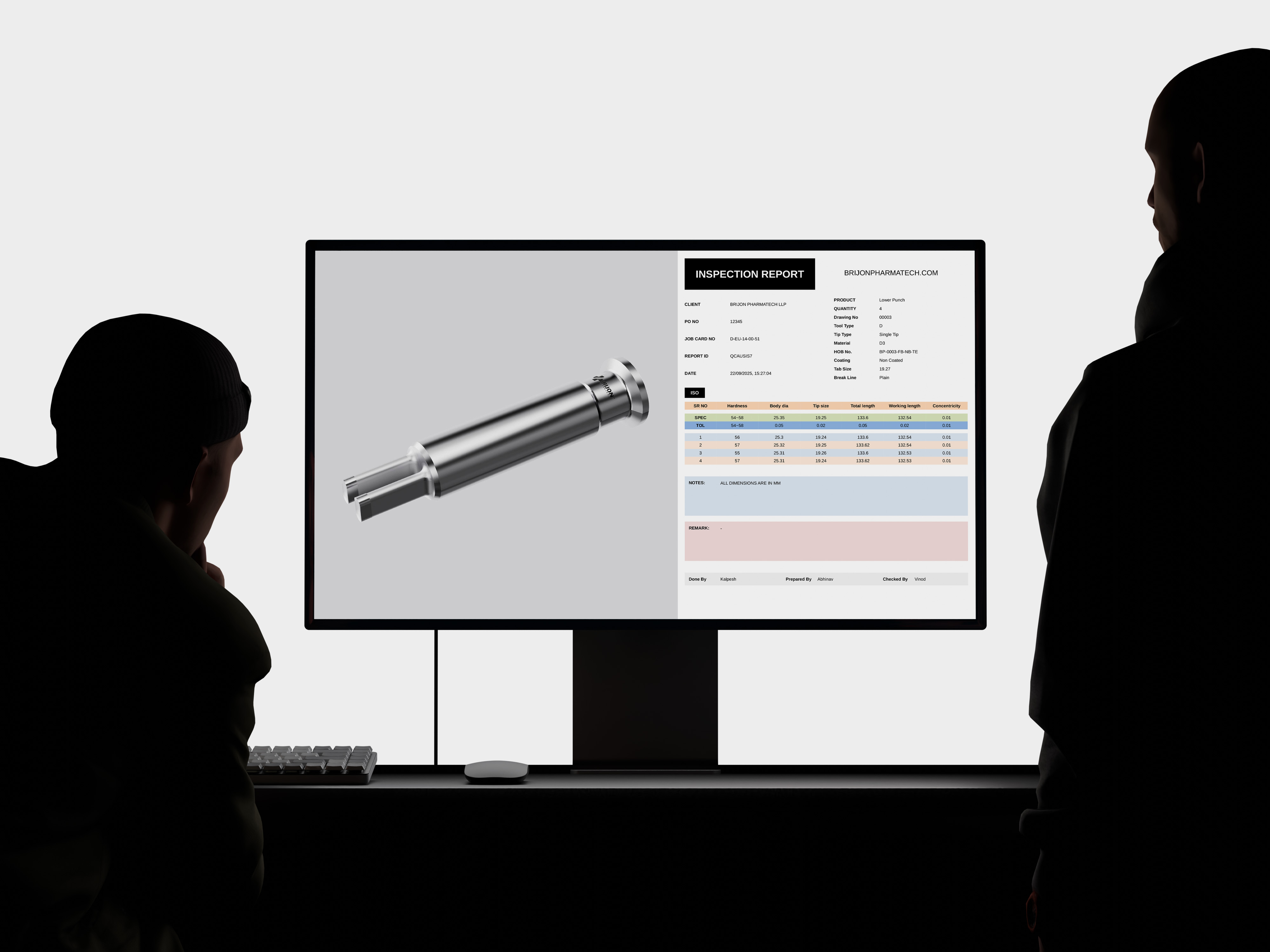 A person standing in front of a computer screen.