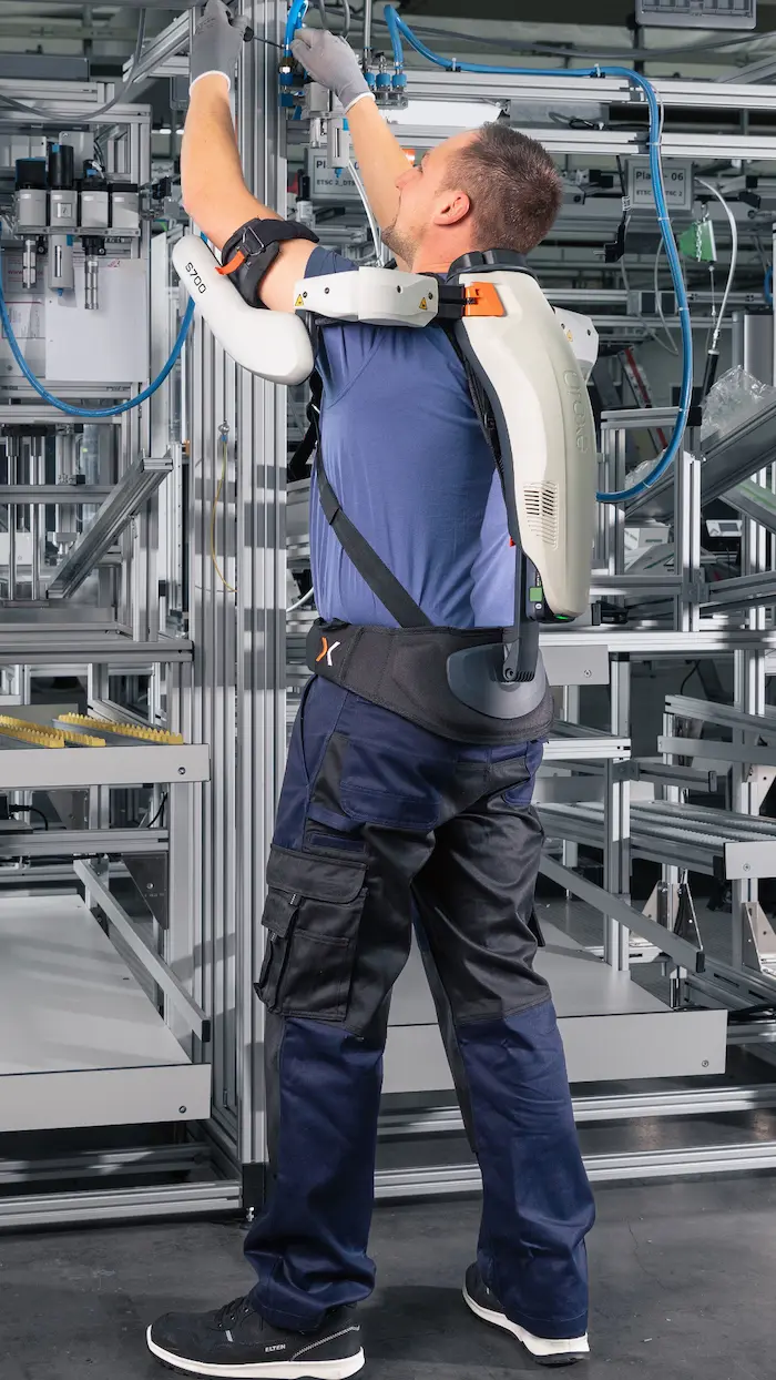 A person works with an active shoulder exoskeleton S700 in industry.
