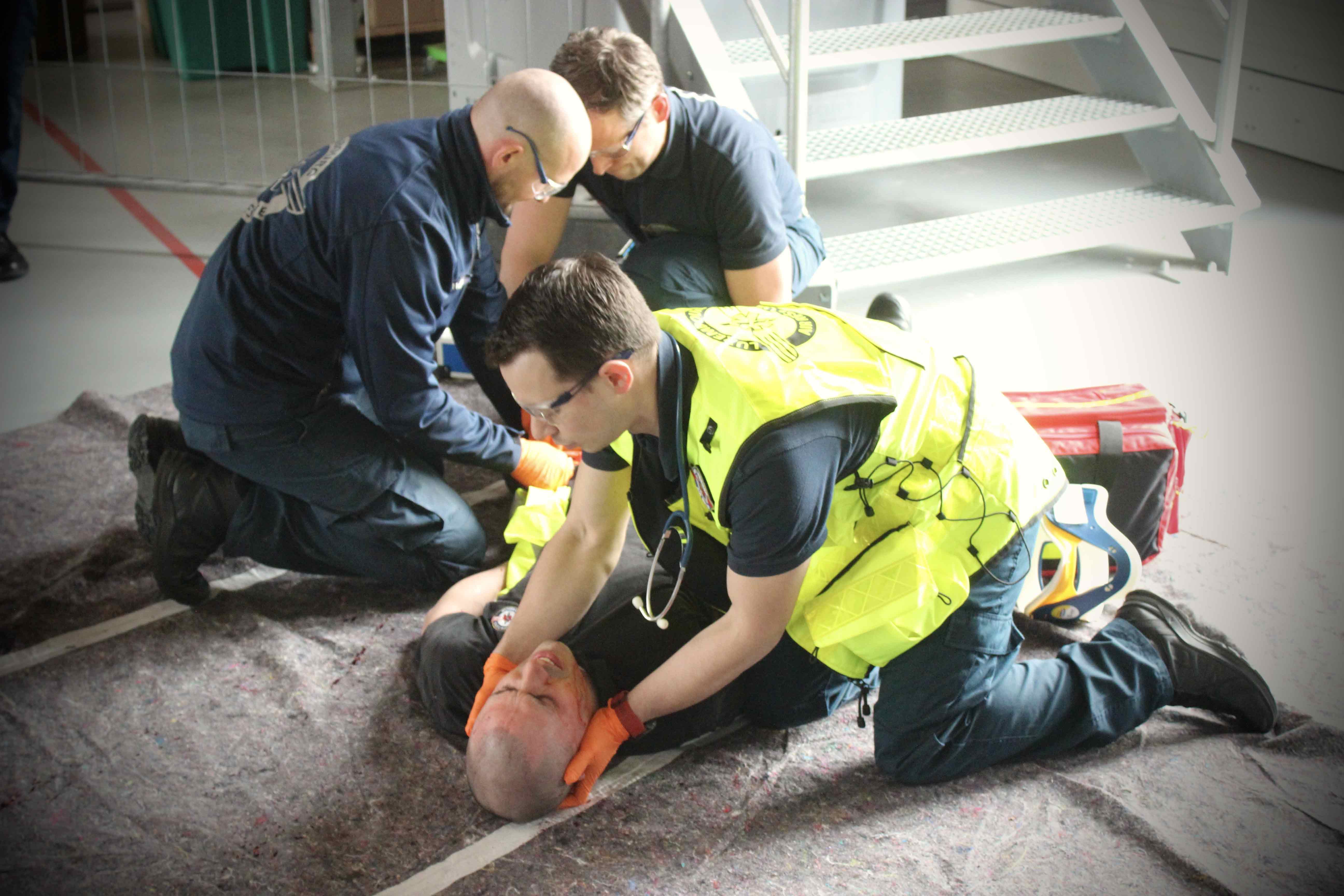 FOTS training session with participants practicing first response and emergency care techniques in a simulated scenario