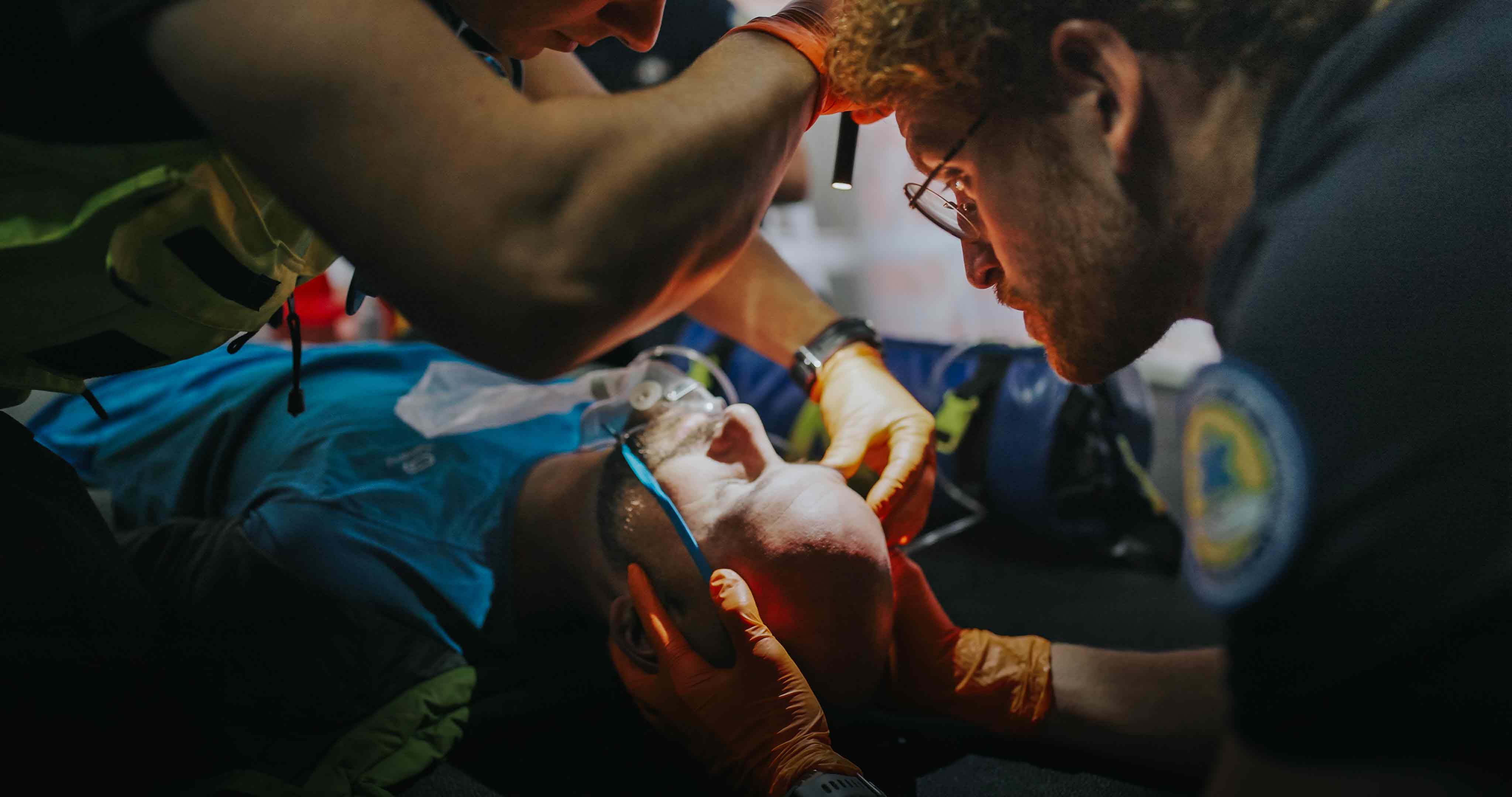 PHTLS training session with medical team practicing trauma care procedures in a simulated emergency scenario