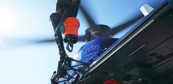 Helicopter hoist operation training with crew performing rescue exercise using winch system