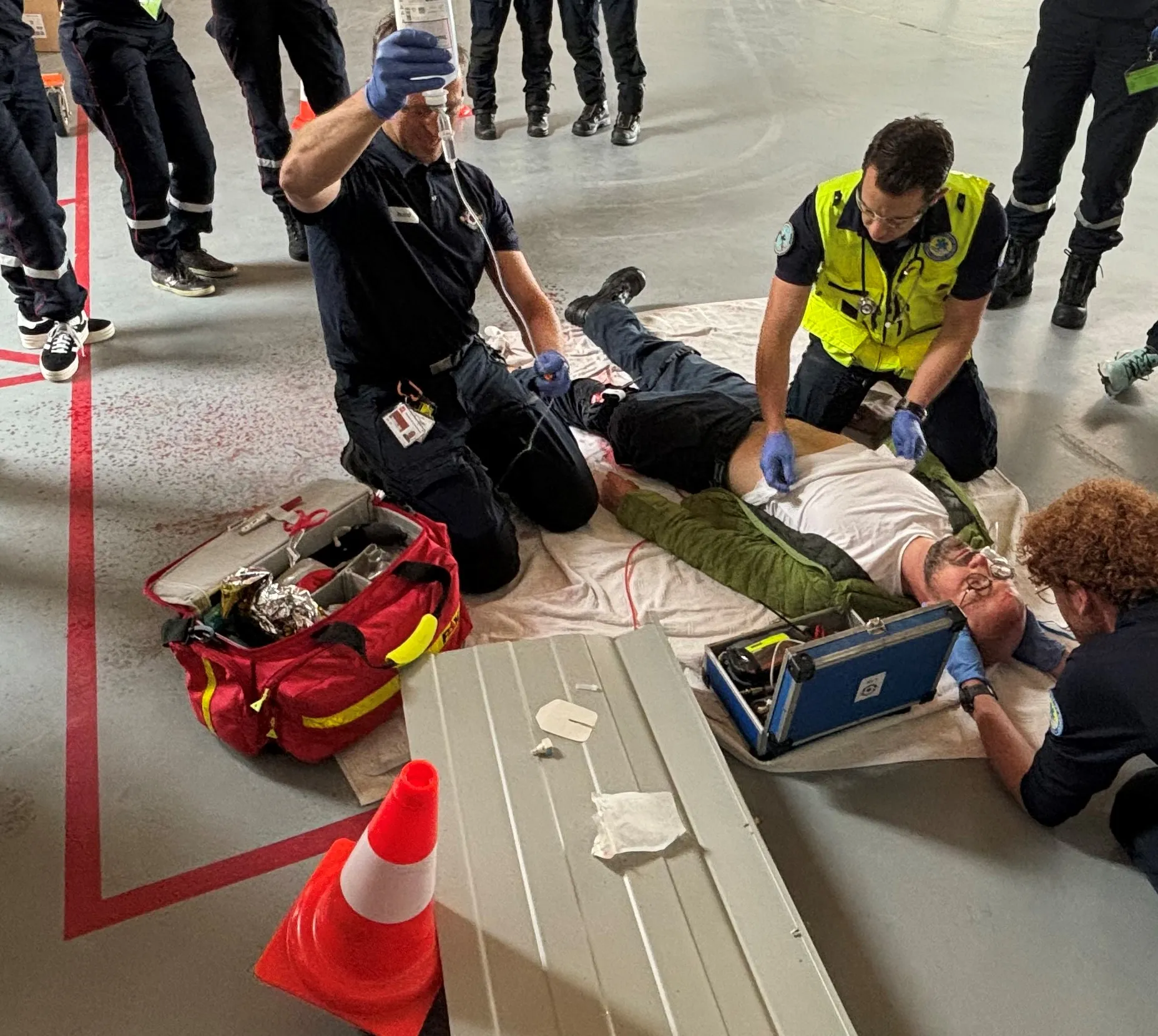 Heliport security officer training session with staff learning safety procedures near a helicopter