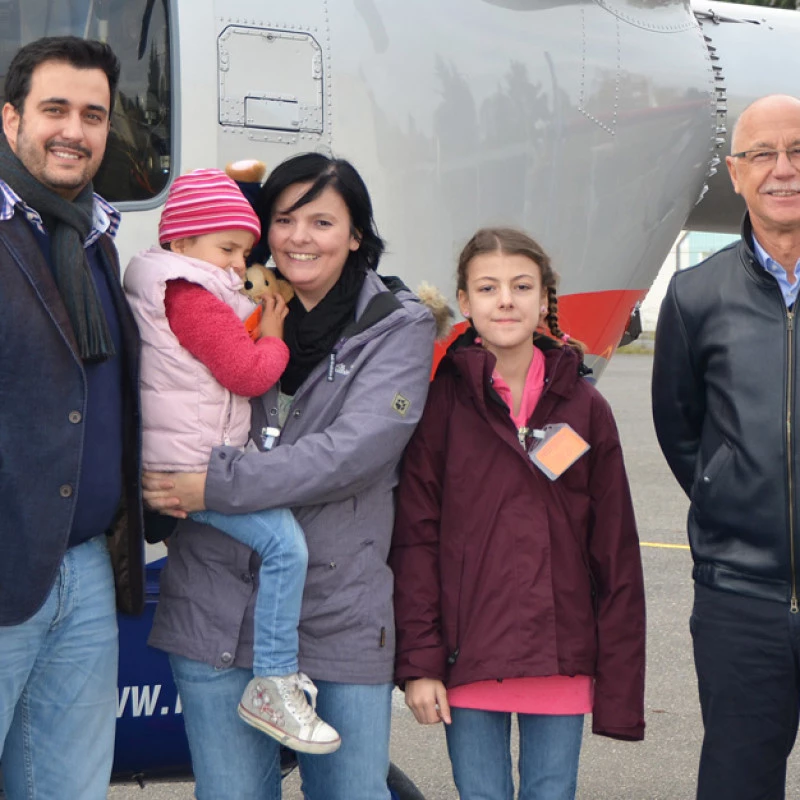 René Closter welcoming the 185,000th member family at Luxembourg Air Rescue headquarters.